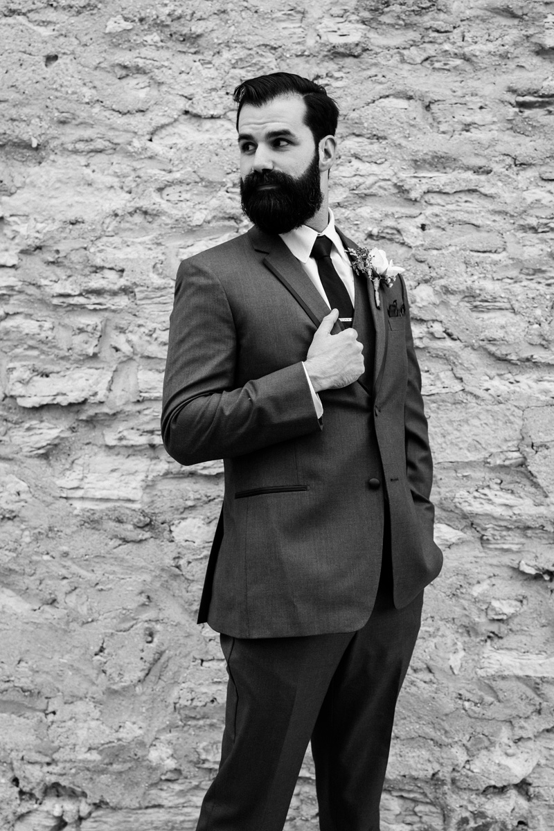 Black and white portrait of groom.