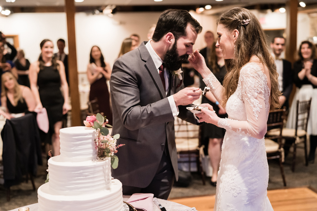 Bride and groom cut the cake.