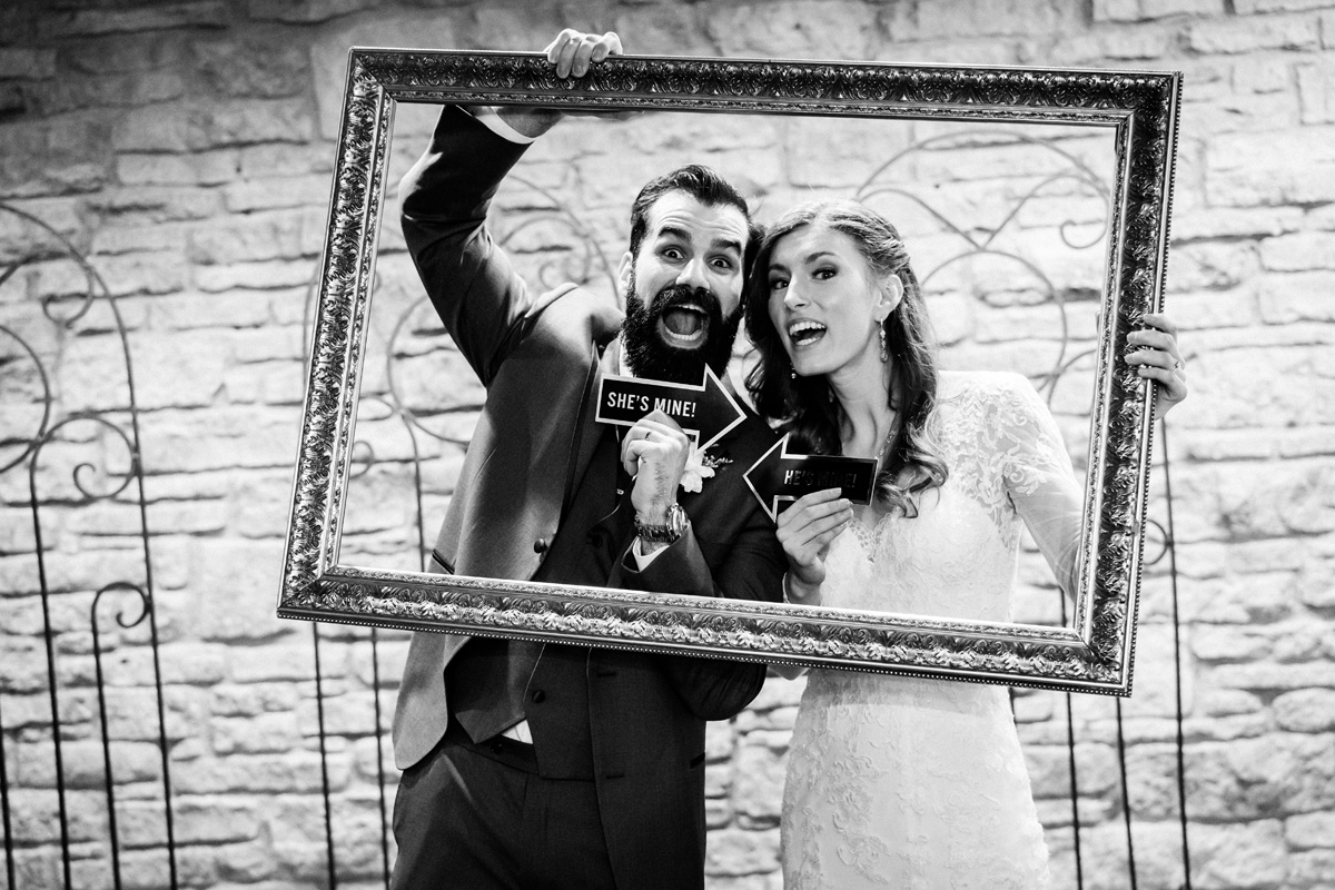 Bride and groom in photo booth.