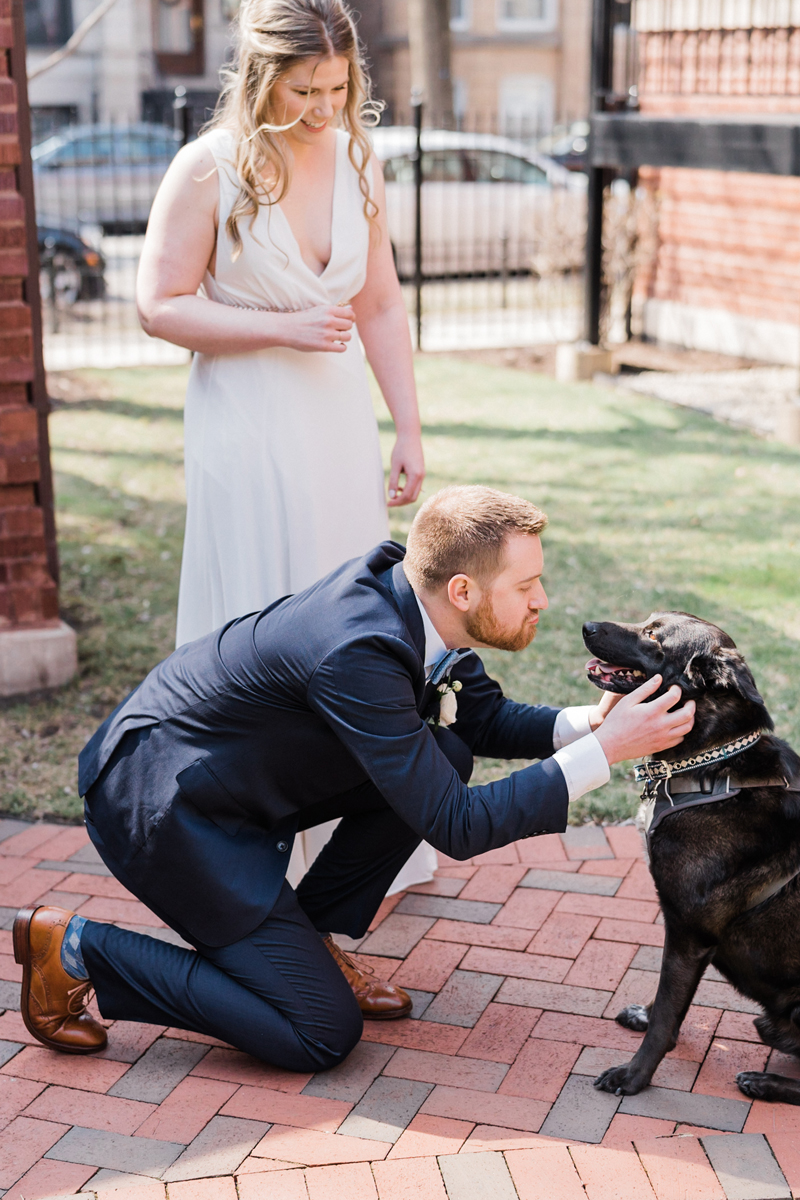 Bride and groom with their dog.