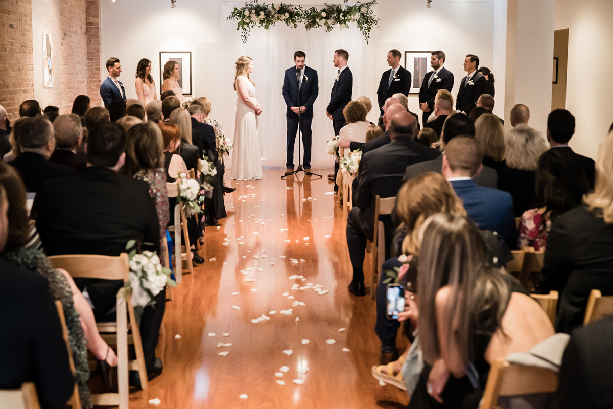 Overall photo of wedding ceremony at Floating World Gallery.