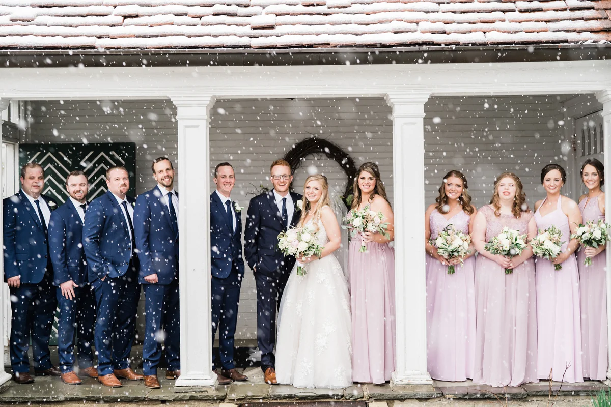 Snowy bridal party portrait.