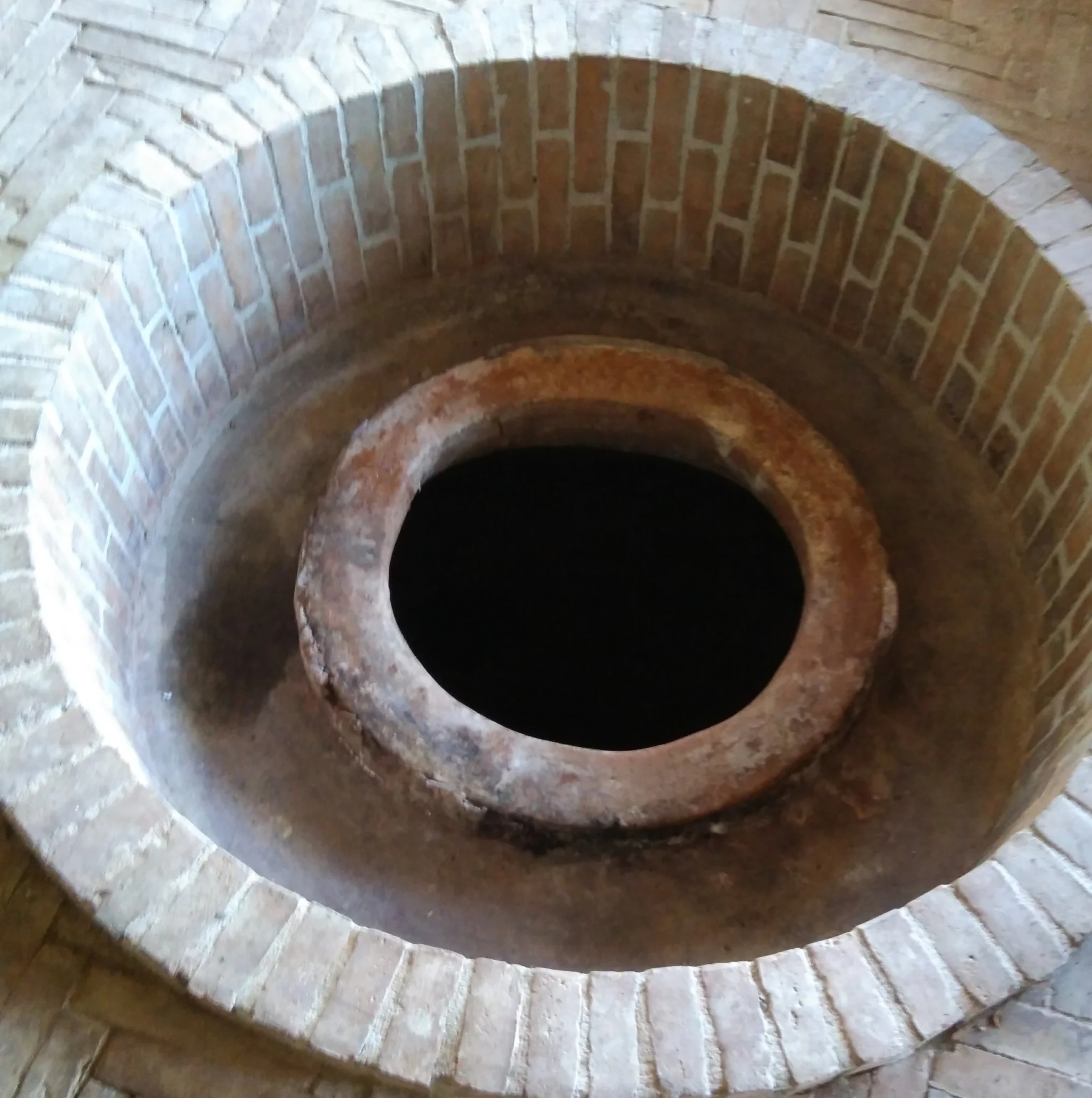 A qvevri ready for traditional Georgian wine in a marani or cellar