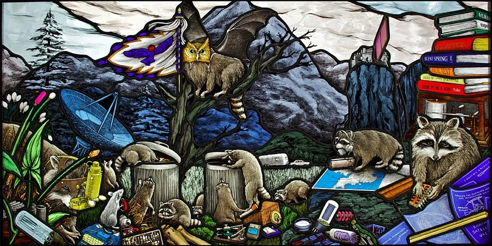 All Utopias Fell : a collaboration with Michael Oatman at MASS MoCA This 102 x 50cm leaded stained glass panel is the translation of a collage by New York artist Michael Oatman into a window for an Airstream trailer. Installed into the front window of the caravan, the stained glass was made as a gift to a fictitious 1970’s amateur astronaut who transformed the 30 foot long camper into a homemade satellite. The Airstream, with it’s 39ft wing span and six photovoltaic panels, is part of Oatman’s permanent art installation All Utopias Fell that opened October 2010 at the Massachusetts Museum of Contemporary Art (MASS MoCA) in North Adams, Massachusetts. Read Art New England interview with artist Michael Oatman about this project. Photo: Art Evans