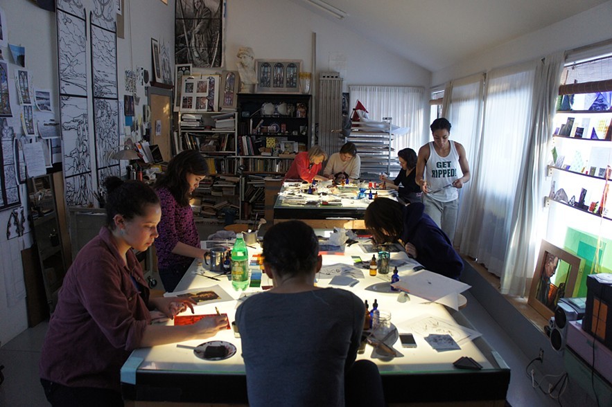 students from Williams College Massachusetts painting self portraits in stained glass