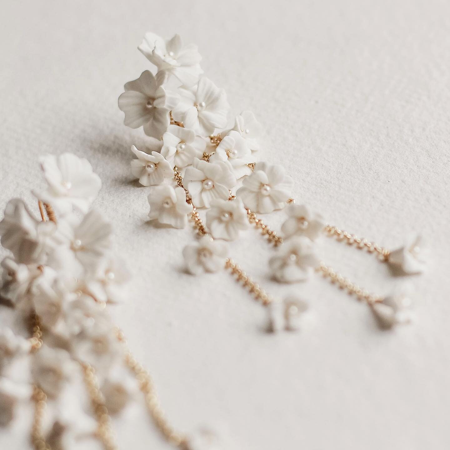 Details of the &lsquo;Beauford&rsquo; earrings, each one adorned with cascading flowers, every petal is hand sculpted and tells a story of artistry and my love for creating. 🌸 ✨ These statement bridal earrings will add that unique finishing touch to