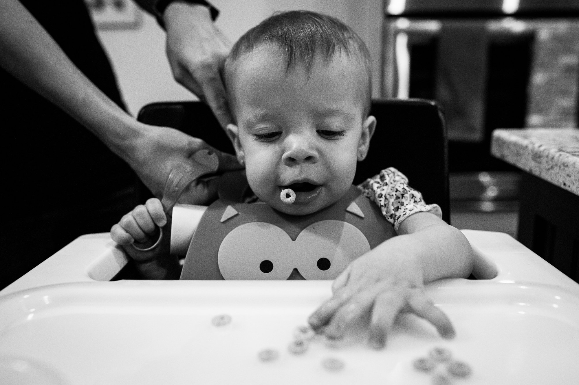 photo of toddler eating cheerios