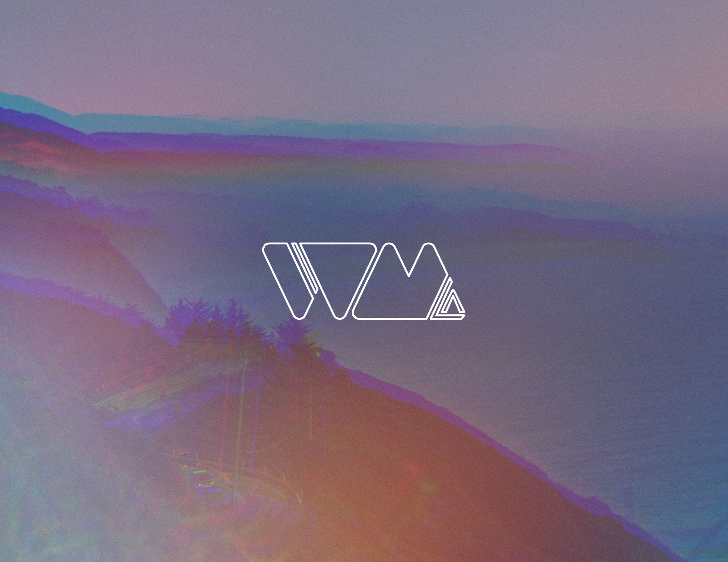 W and M outline with LA to the side in the foreground with LA coast line of cliffs and pacific ocean in the background