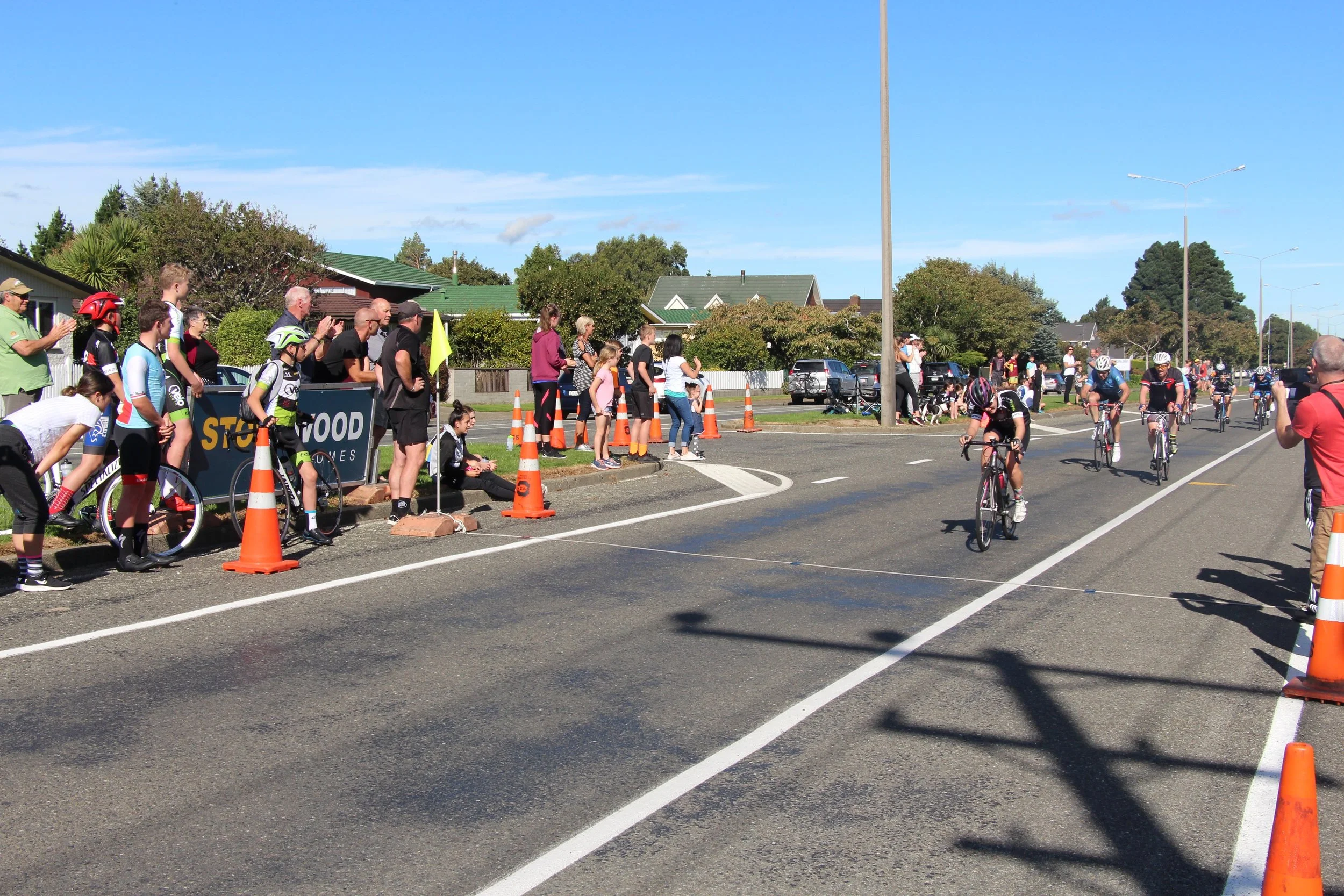 KateWilson crosses the finish line at Racecourse Rd. Photo: Cycling Southland