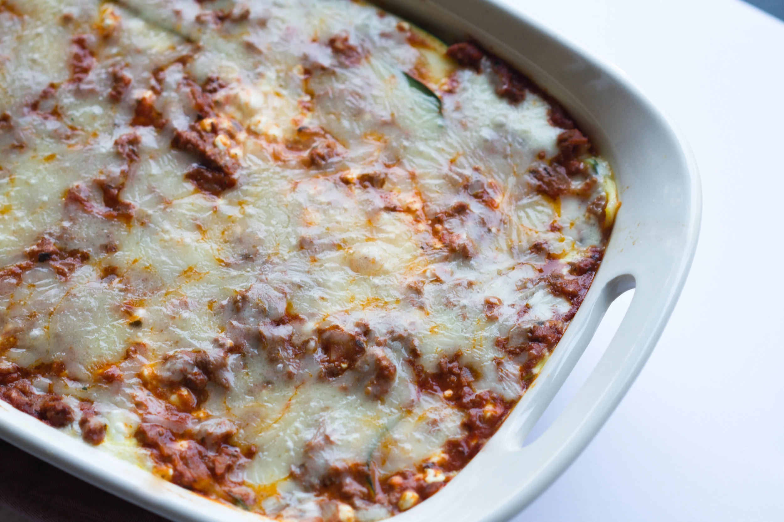 zucchini lasagna in a white pan ready to eat