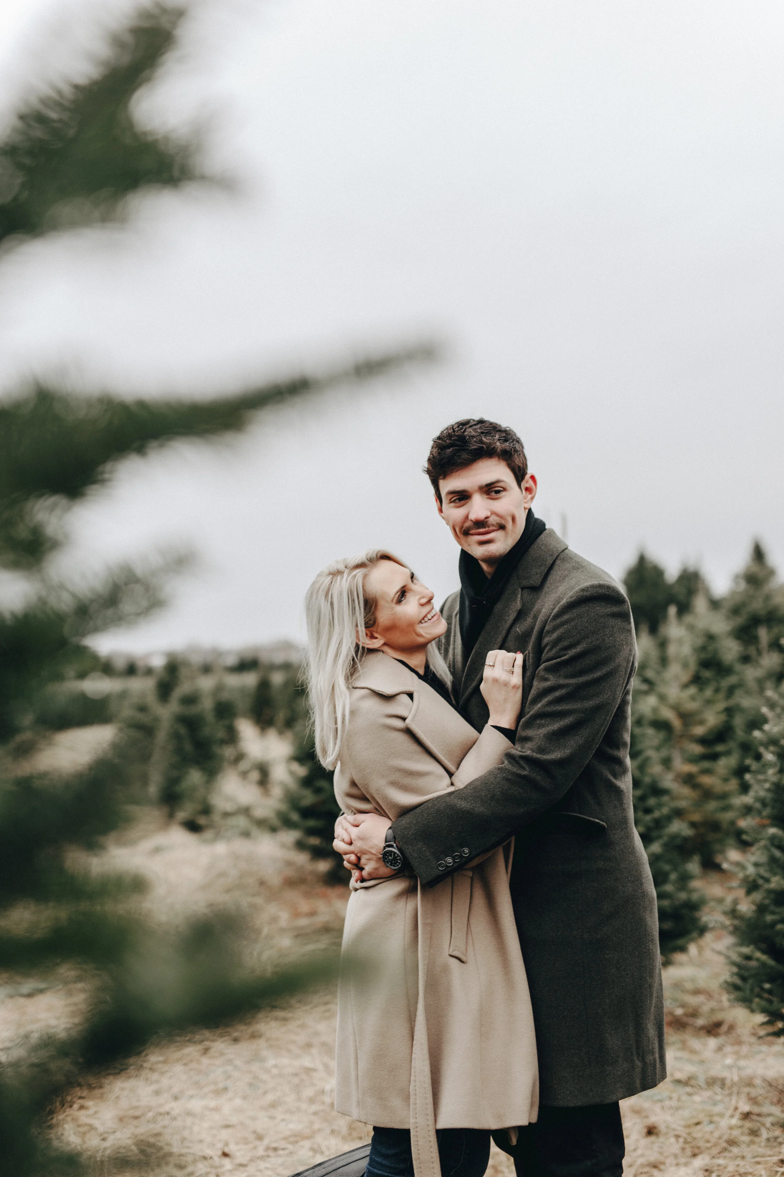 carey and angela price christmas shoot in trench coats