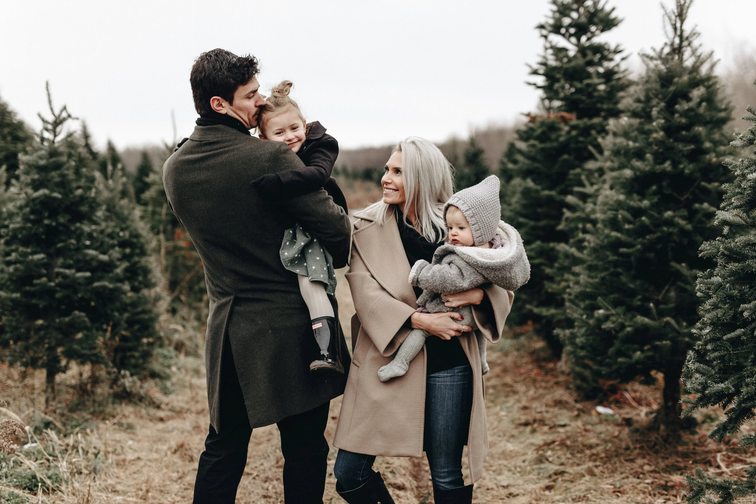 carey, angela, liv and millie price at a christmas tree farm
