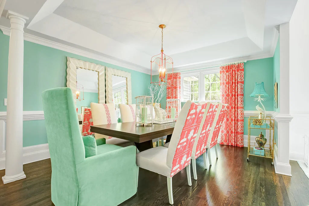 Bright dining room with pink flamingo upholstered chairs
