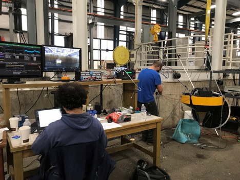 Alex and Max get the Aquaharmonics WEC and sensors ready for test in the flume at O.H. Hinsdale