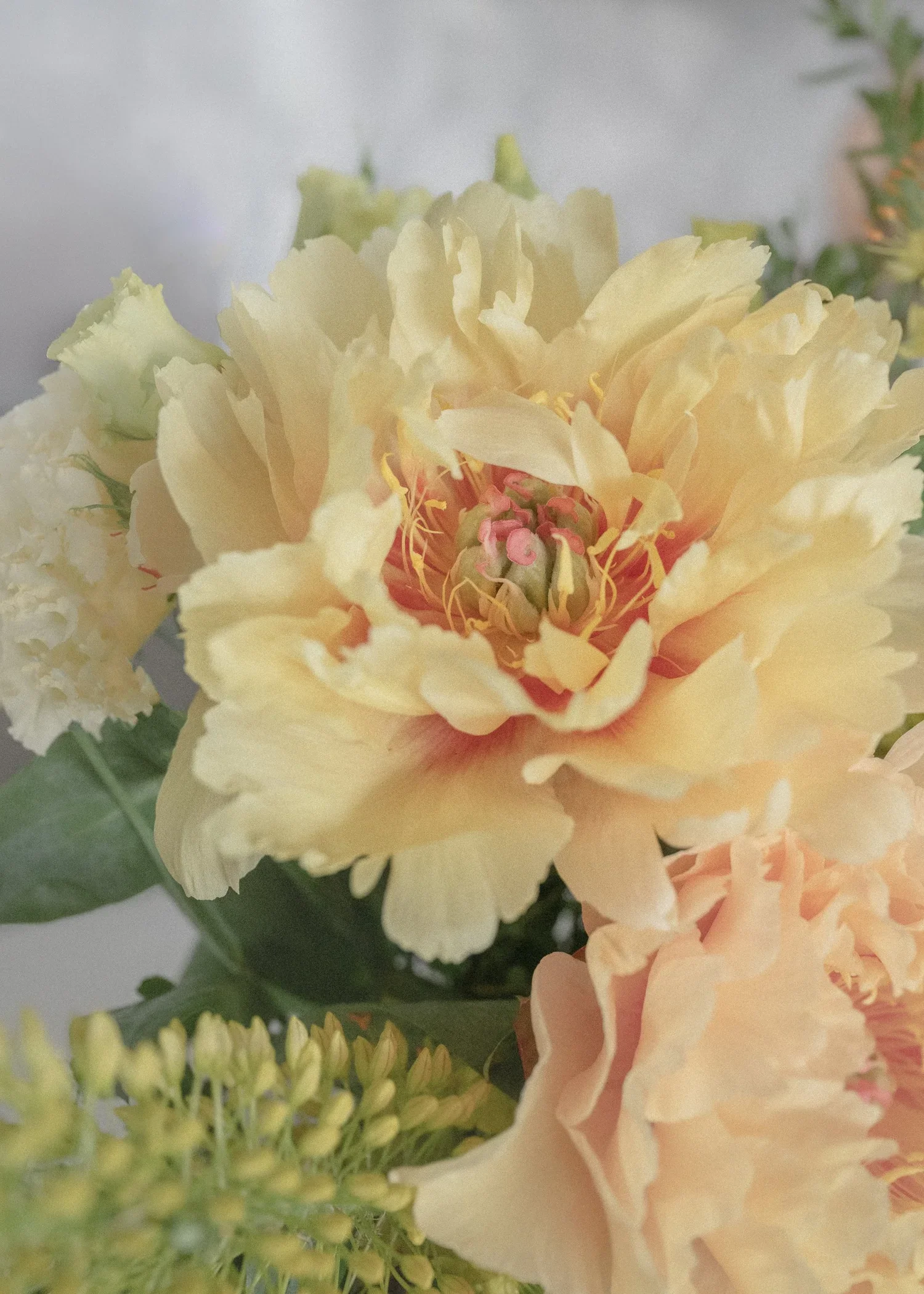 Yellow peonies and pale yellow lisianthus.