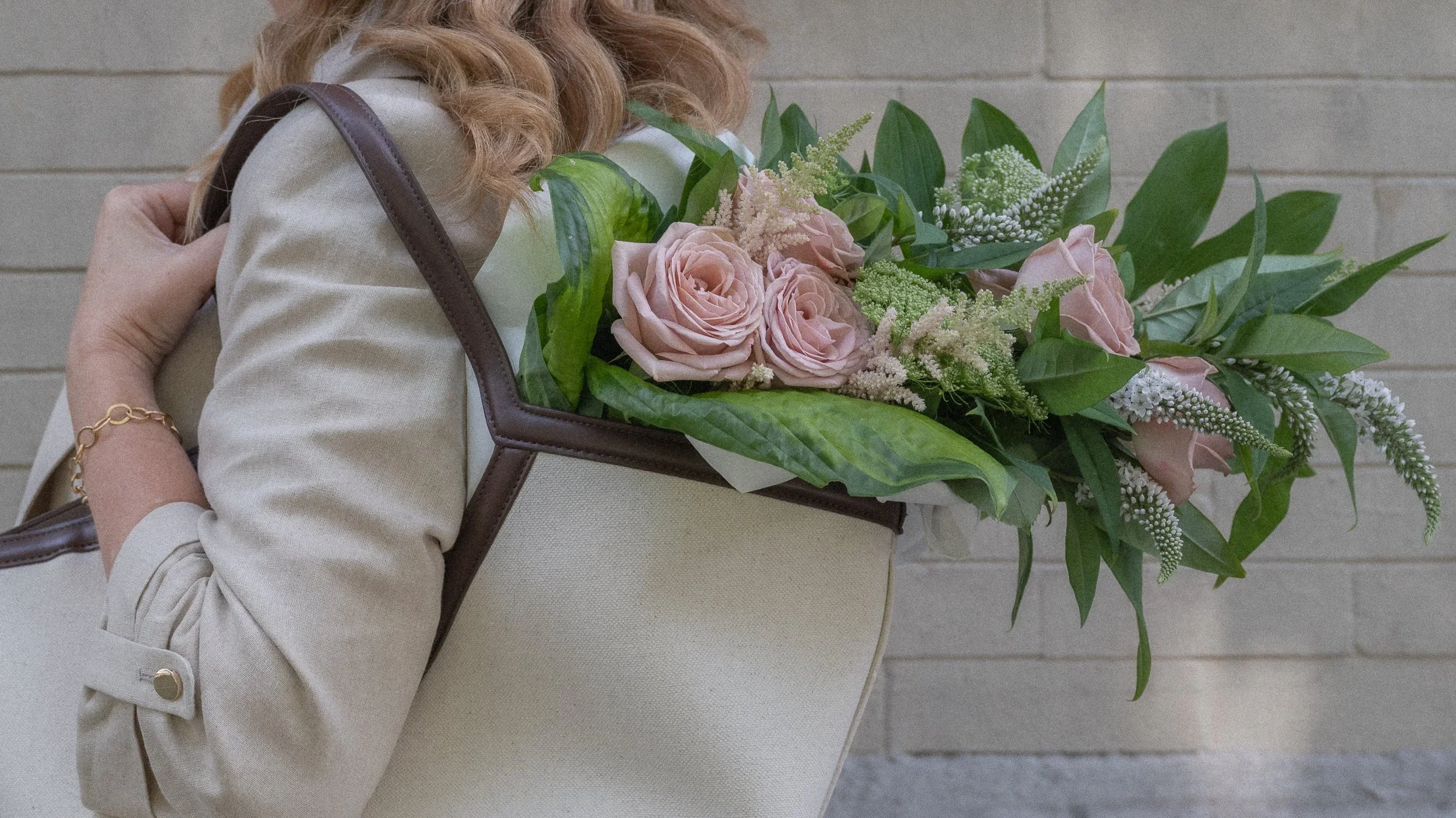 Karla Dreyer with a bag of lavender roses in Vancouver.