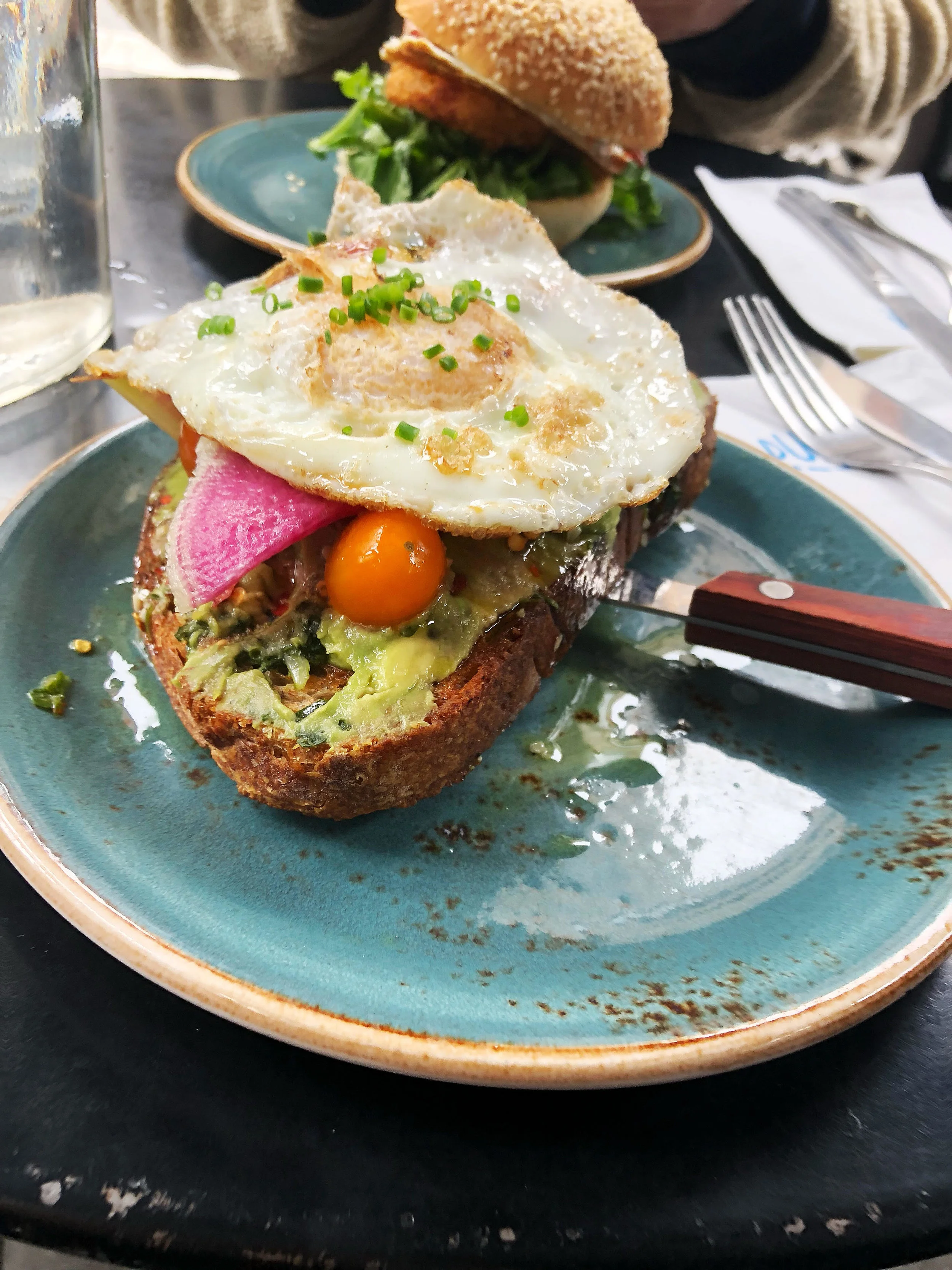Avocado on toasted multigrain with salsa verde + cherry tomatoes + fried egg