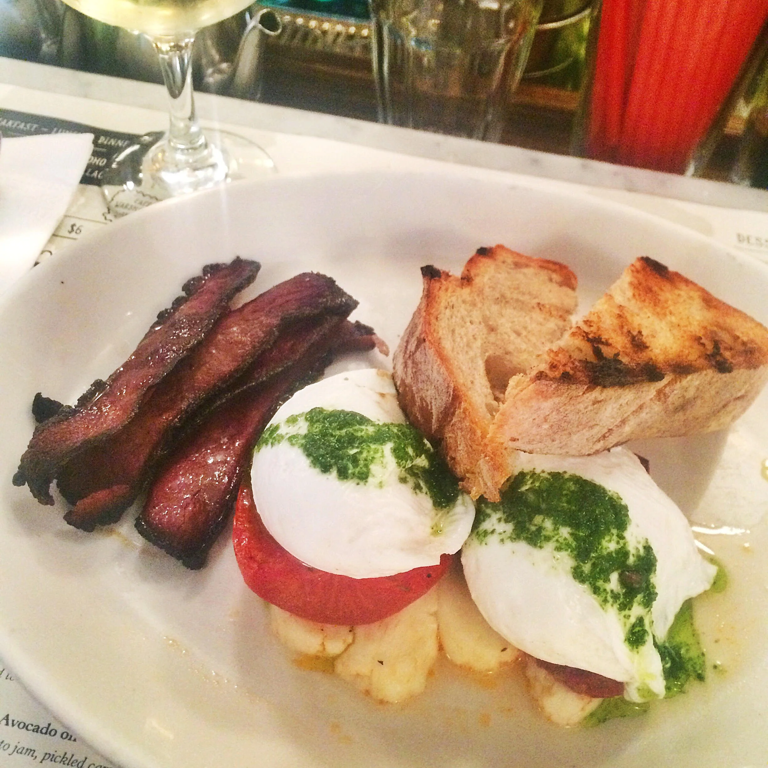 Poached eggs with grilled tomato and haloumi