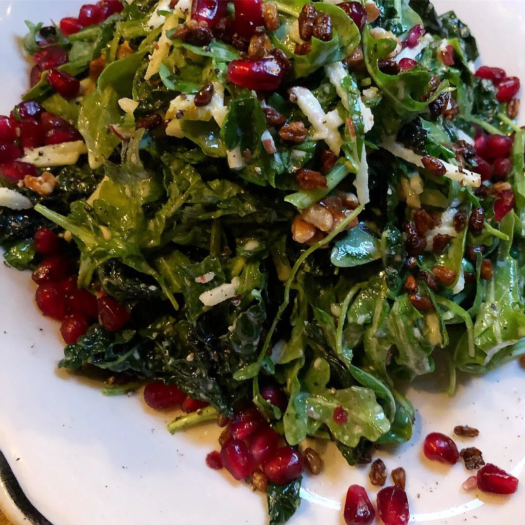 Kale apple salad: roasted kale, goat cheese vin, seasonal fruit, walnuts, crispy freekeh