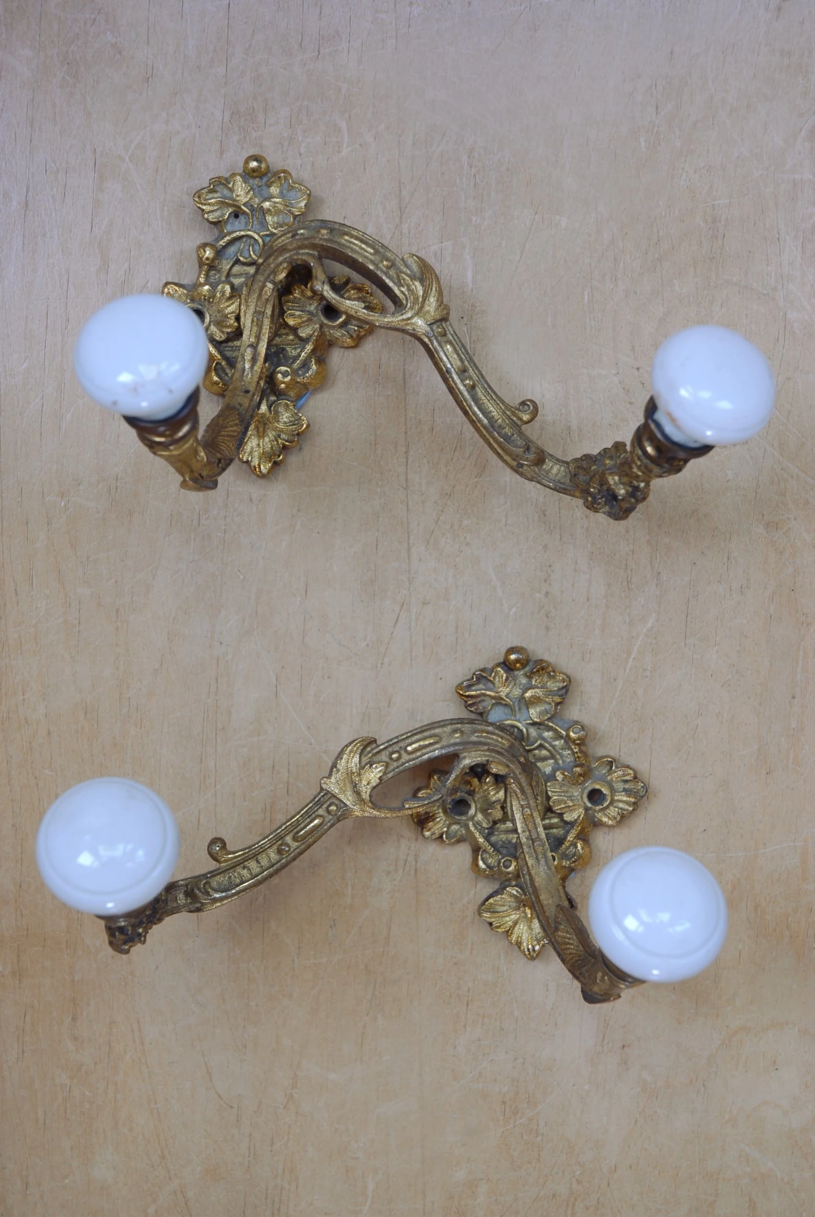 A Pair Of French Gilt Asymmetric Hooks