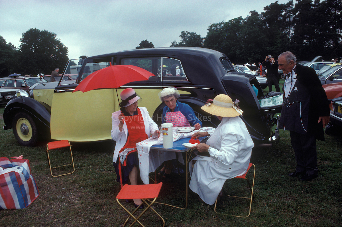 Royal Ascot, picnic in car park No 1. Berkshire England. The English Season published by Pavilion Books 1987. Page 89. Yellow Rolls Royce. 
