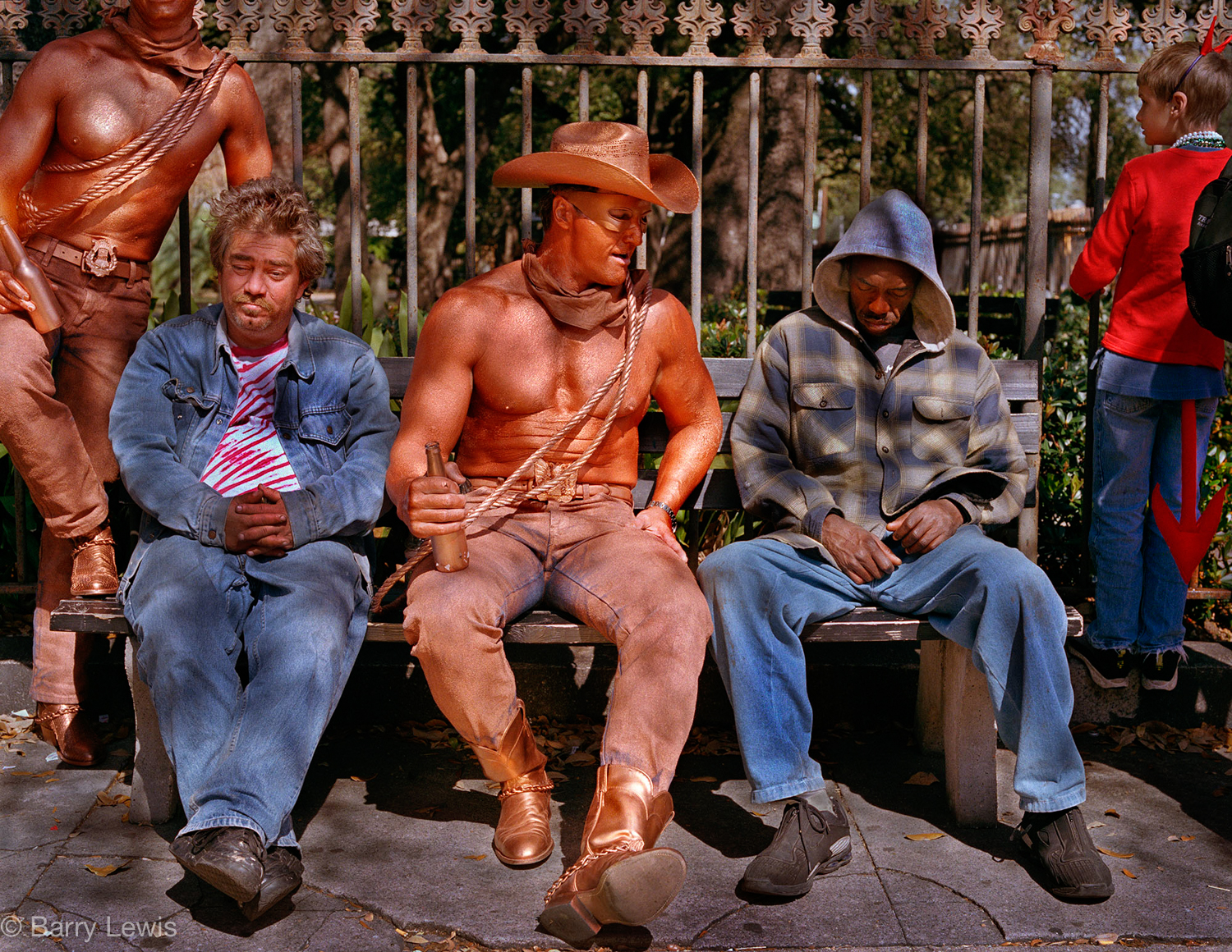  Revellers, some in costume, awaiting a parade, Mardi Gras, New Orleans, 2002 