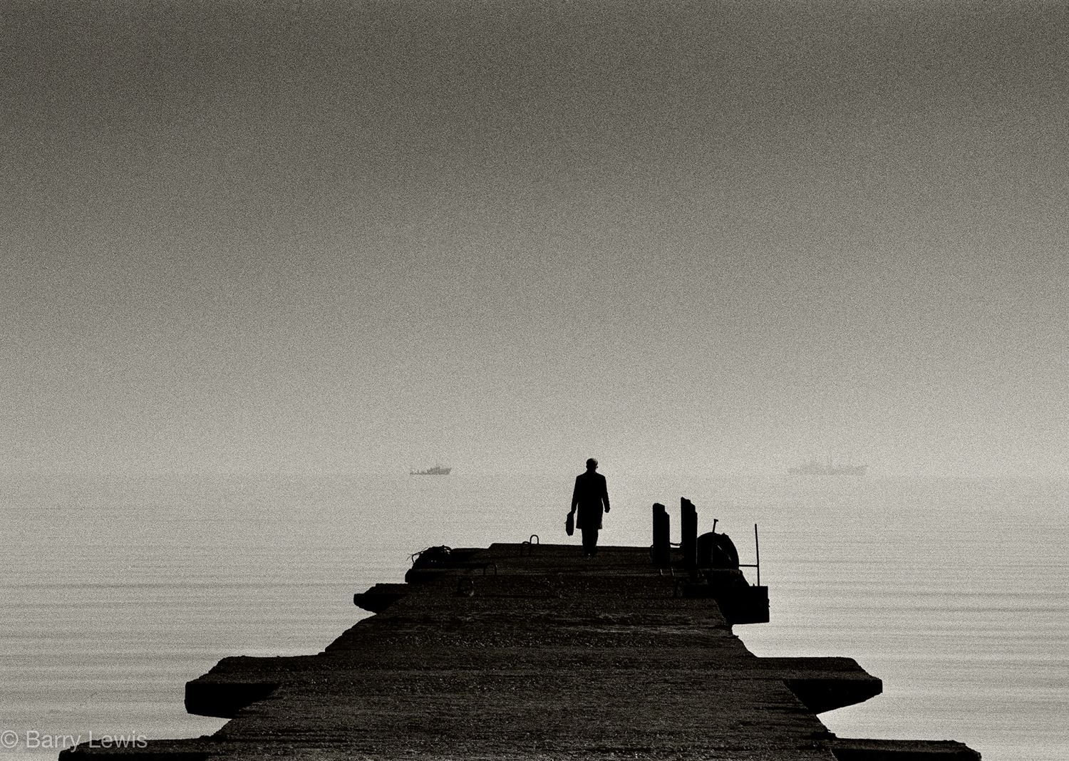  Durres, Albania, man looking out to sea, 1989.
From the start of the 1990s, over a million Albanians have fled abroad seeking jobs because of the wretched standard of living and limited economic opportunity at home. 