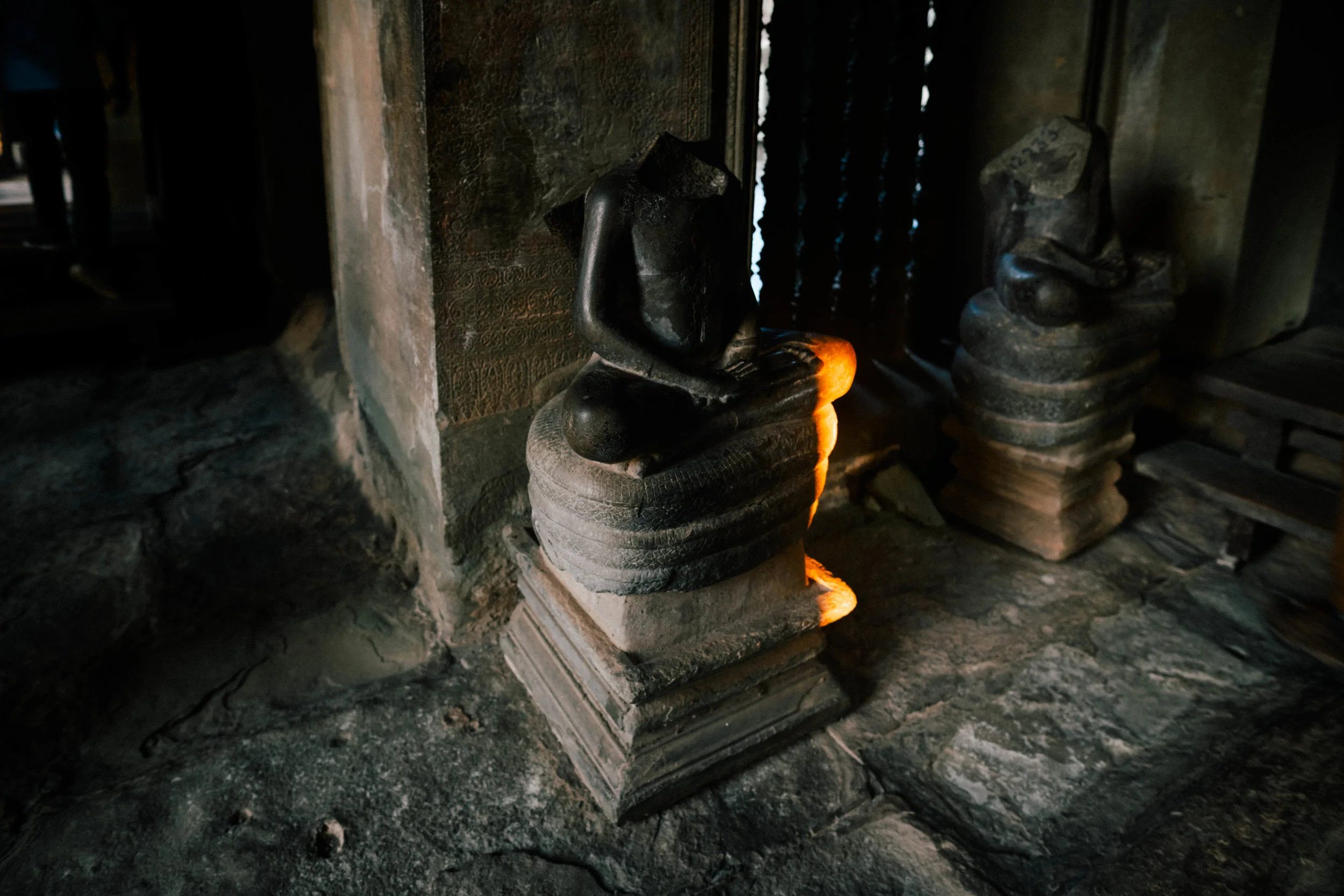 light and a headless statue