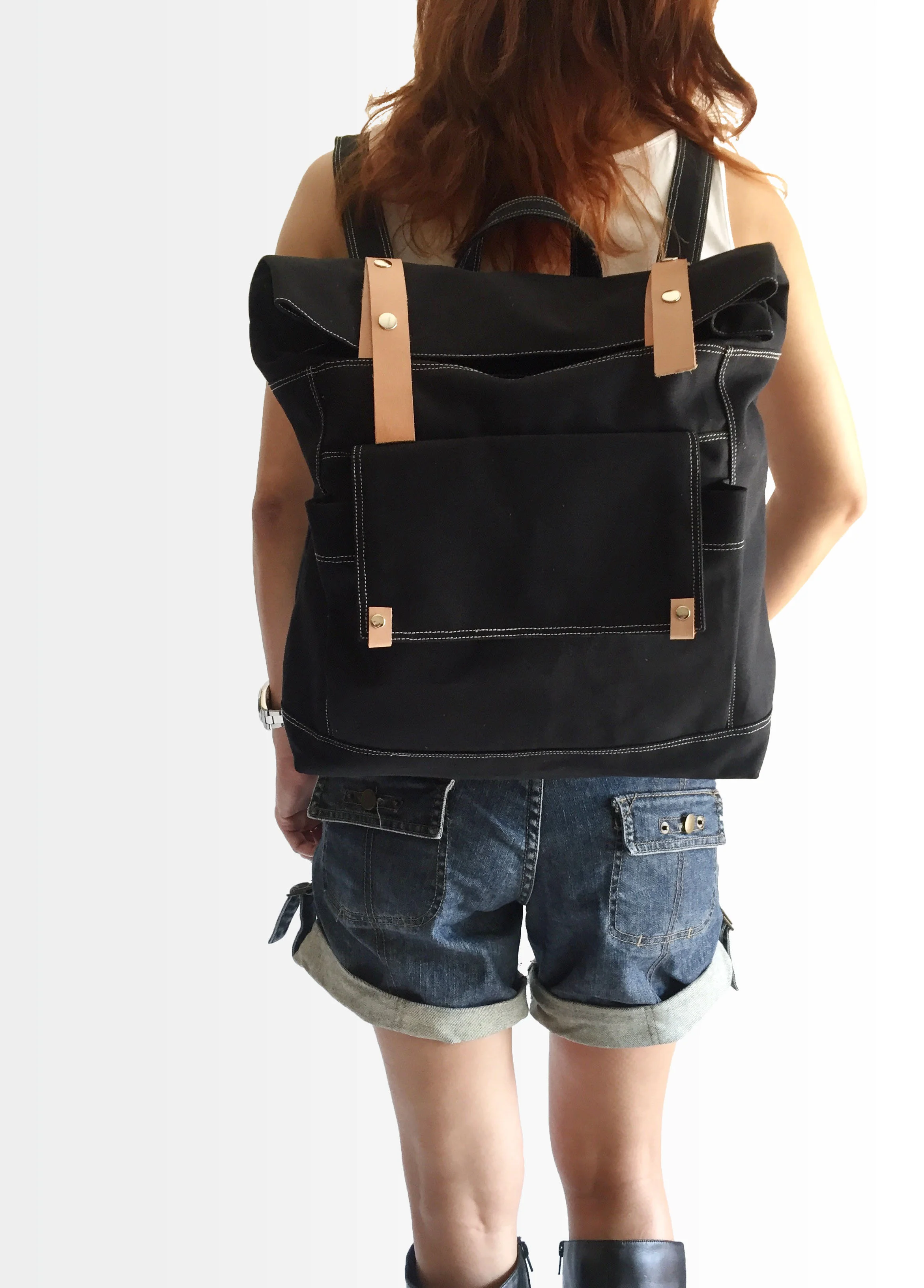 model carrying black backpack.jpg
