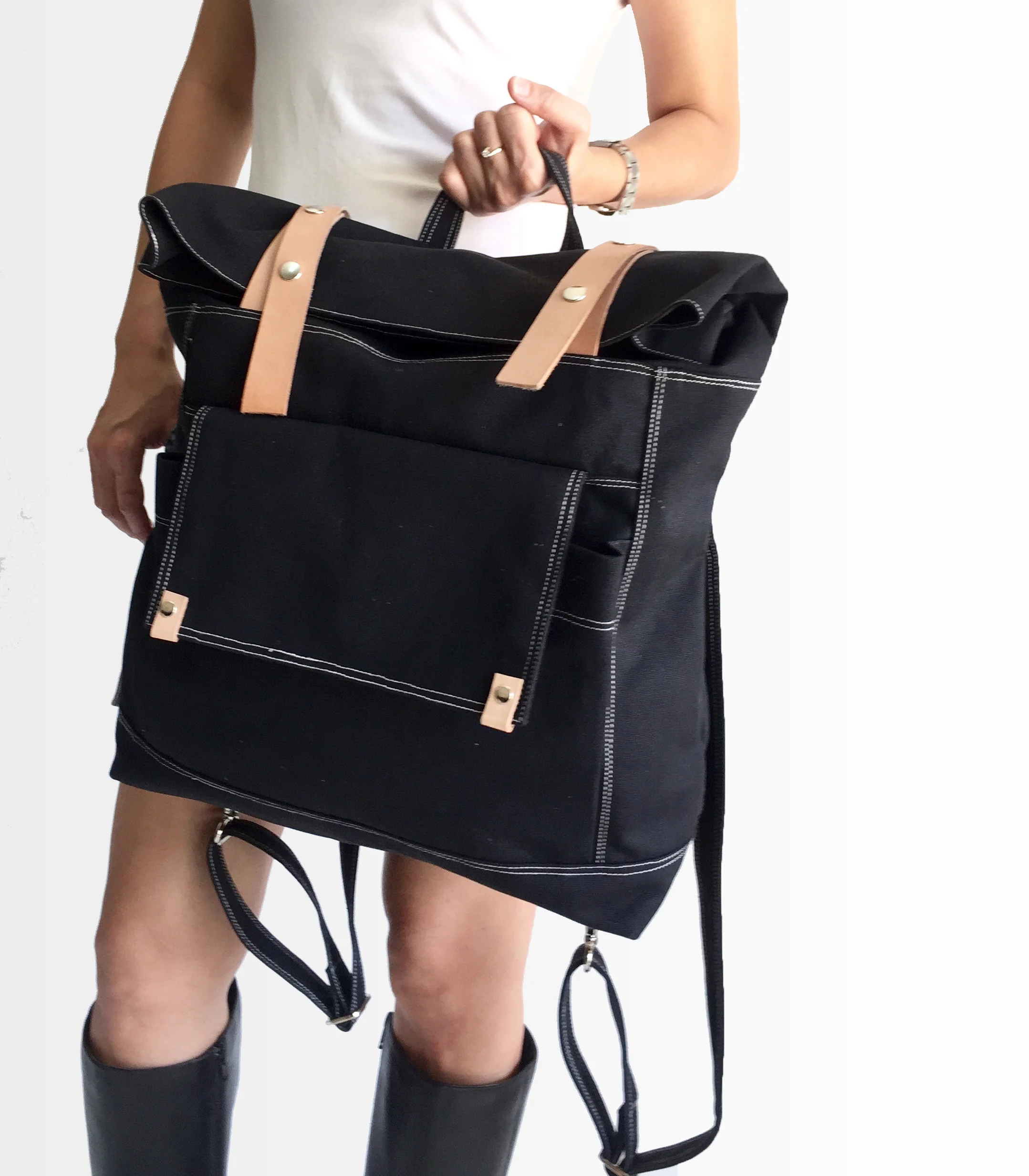 model holding black backpack.jpg