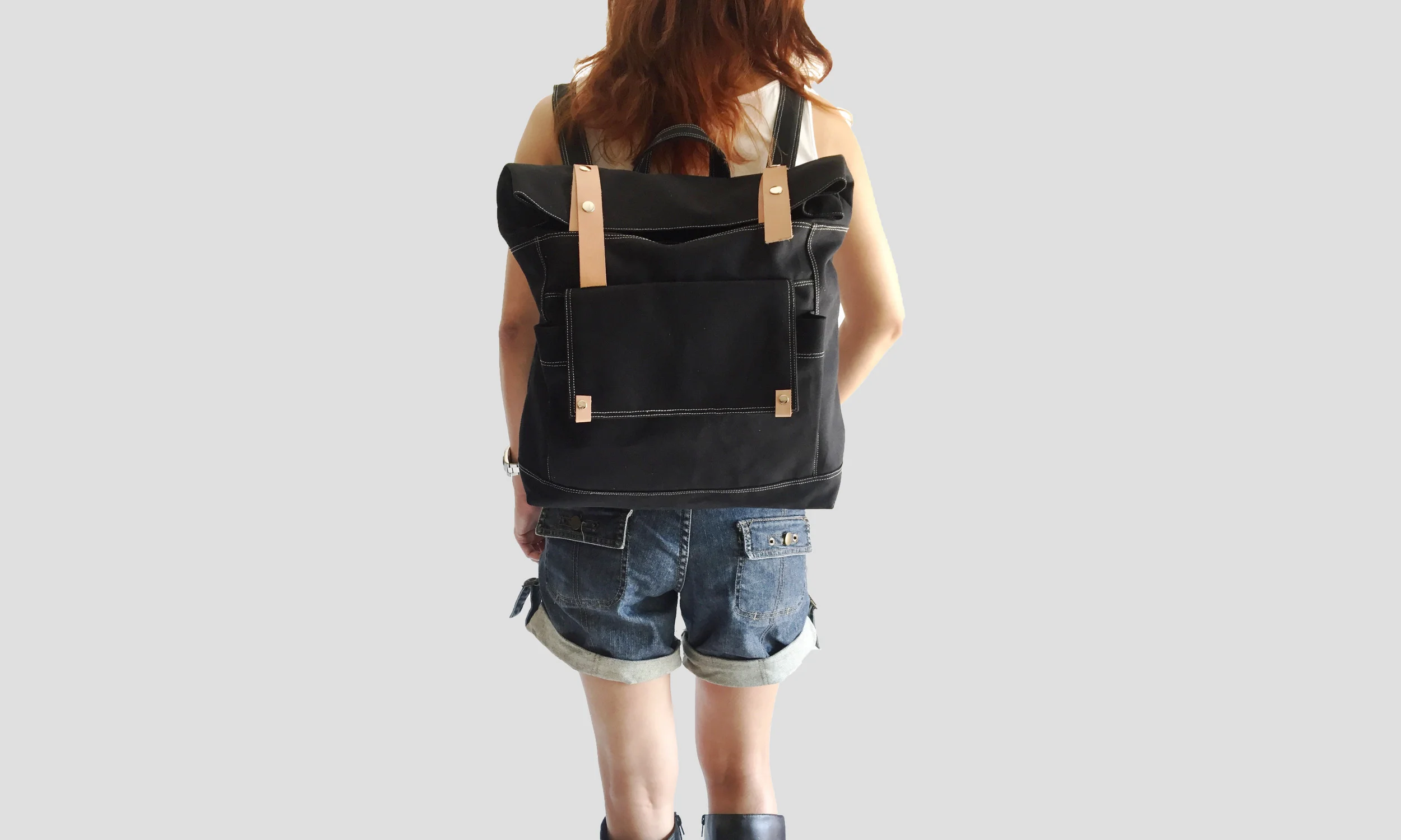 Model carrying Allison black backpack.jpg