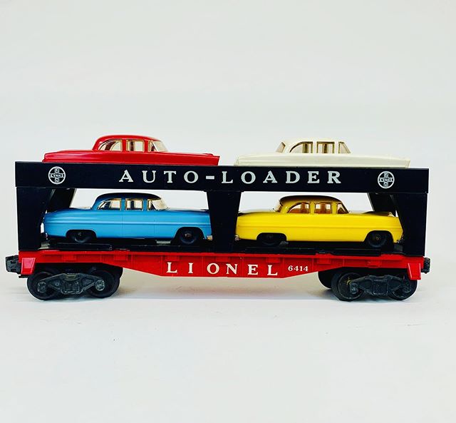Lionel 6414 with very rare robin egg blue automobile.  We have only had a few of these over the years.