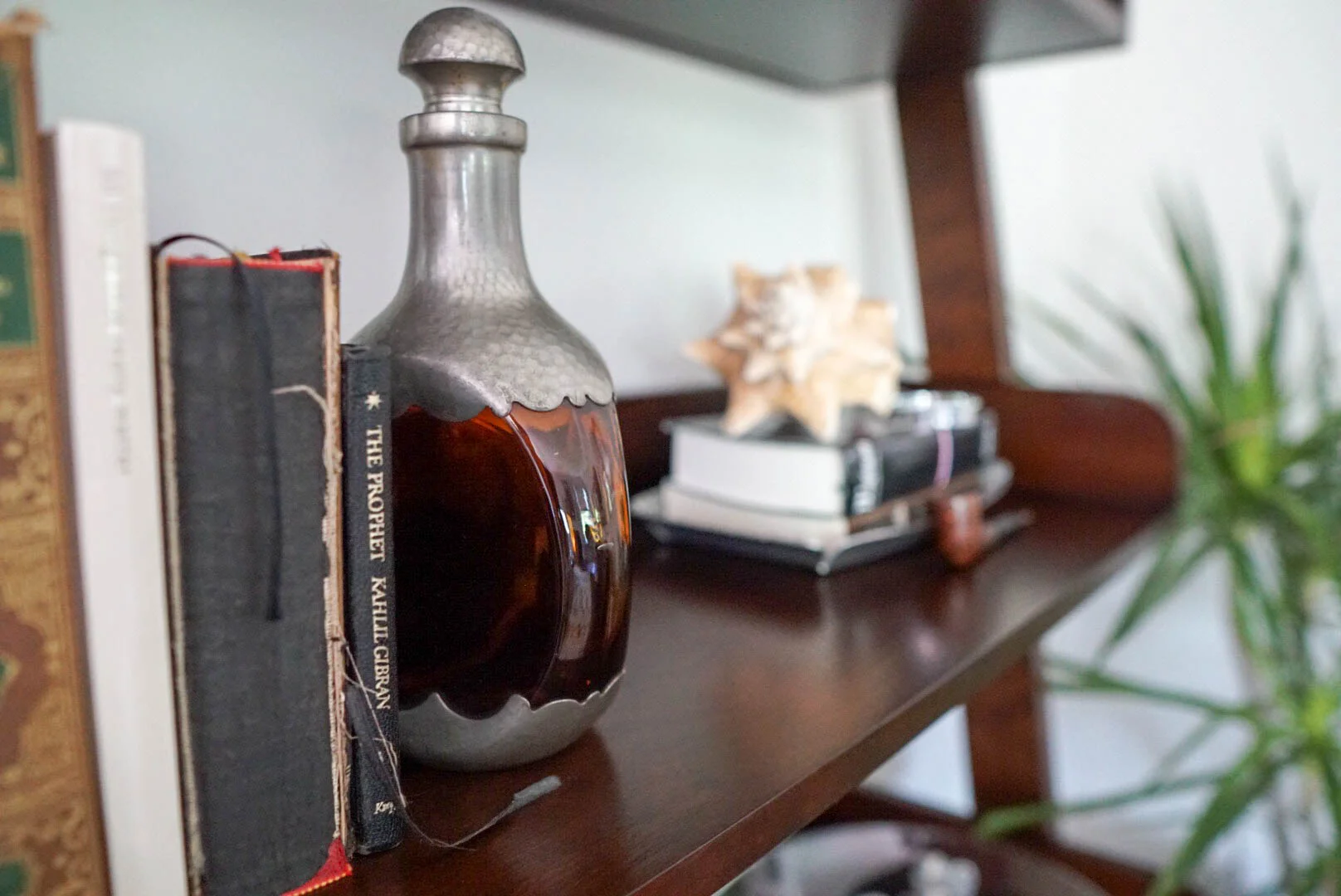 Pop-Pop's antique liquor bottle serves as the perfect bookend (and his old pipe). 