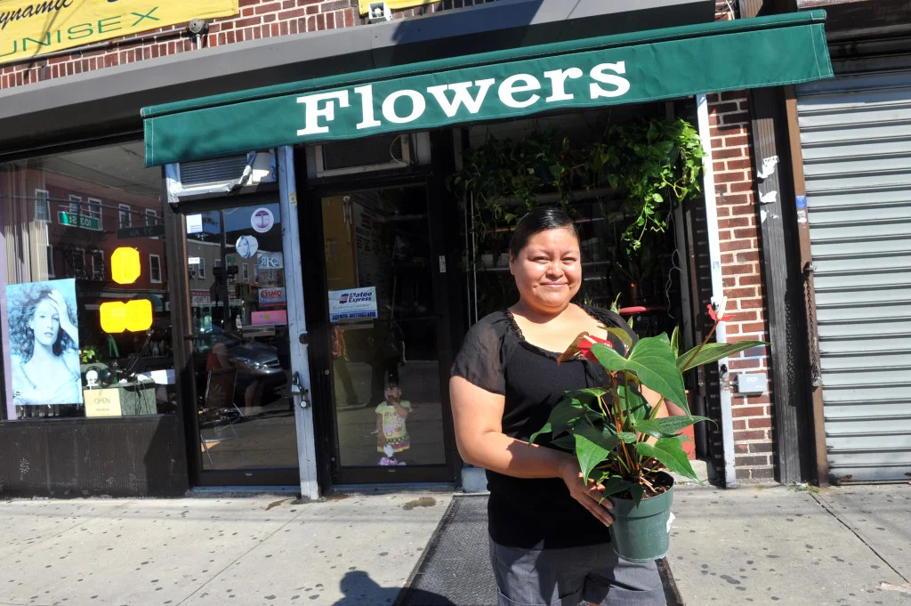 Grameen America member at her flower shop. Photo credit: Diane Bondareff