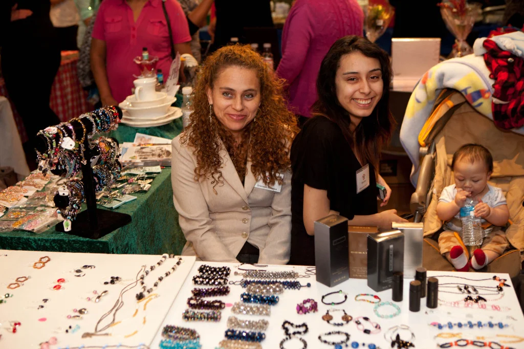 Grameen America members selling jewelry at a holiday market