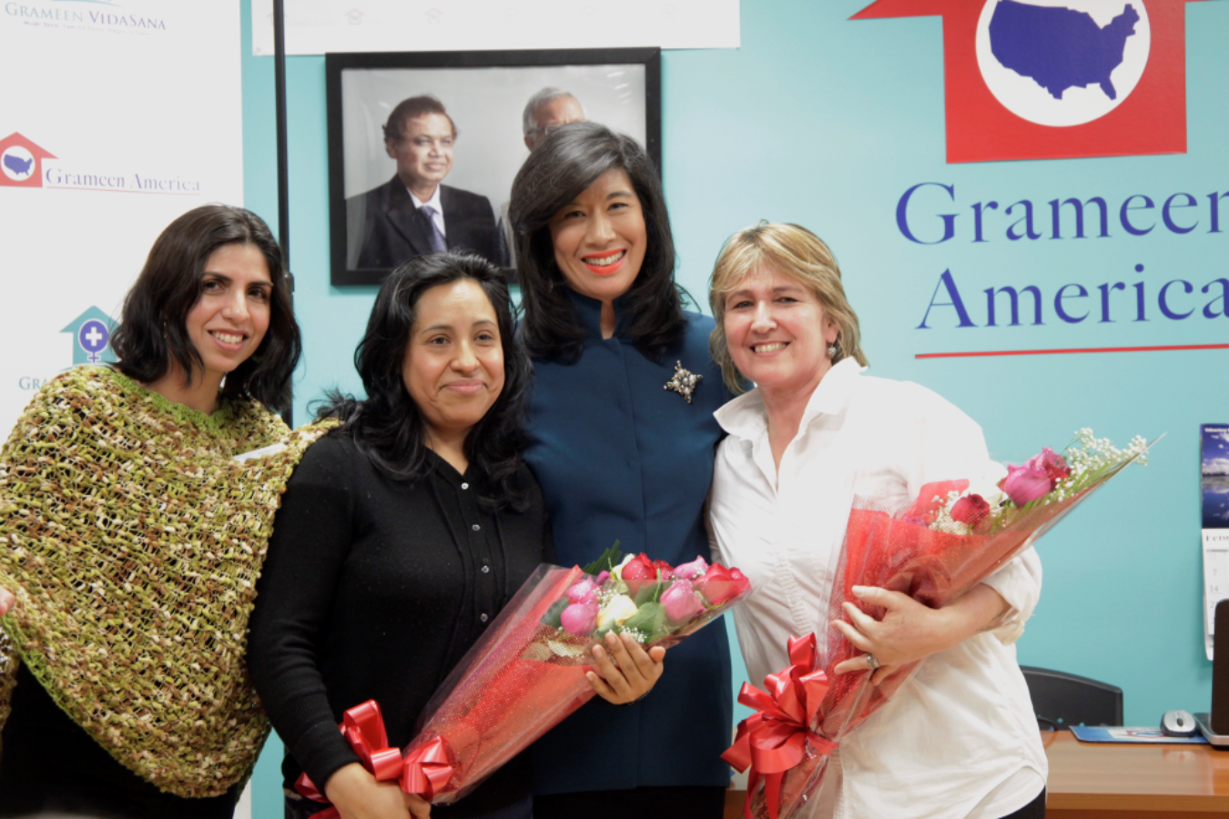 Grameen America President Andrea Jung celebrates the launch with members of Grameen America and Grameen VidaSana. 