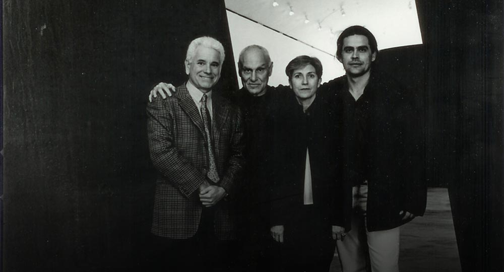  With Carmen Gimenez, Richard Serra, and Siro De Boni, during the installation of Richard Serra’s Torqued Ellipse. Guggenheim museum, Bilbao, 2003. 
