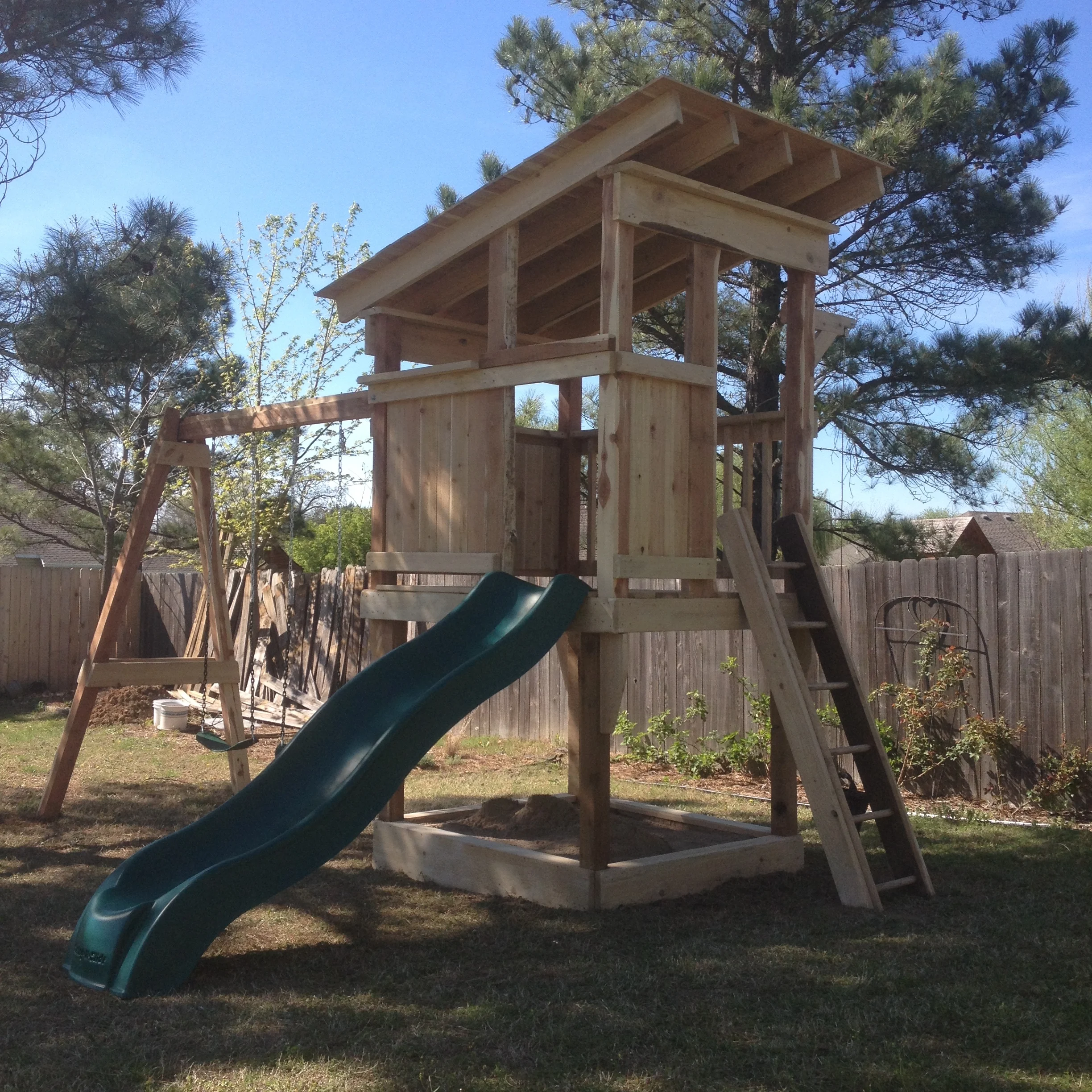 outdoor playset with sandbox