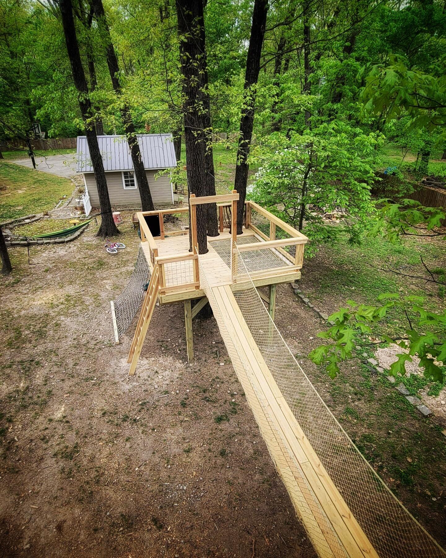 Super cool double treehouse with 26&rsquo; long swinging bridge, a lounge hammock and every fun accessory we could think of.  Thanks to @snaker85 for leadership and superb craftsmanship on this project.
.
#treehouse #swingingbridge #hammock #arkansas