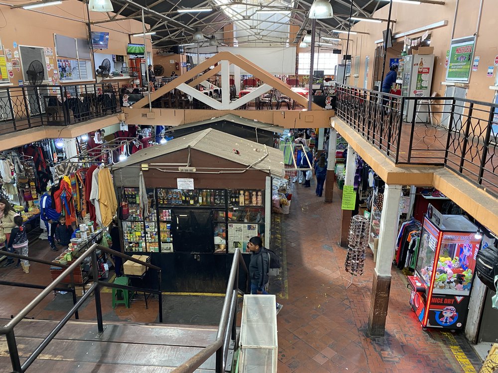 Huge indoor market selling food, clothes &amp; fabrics