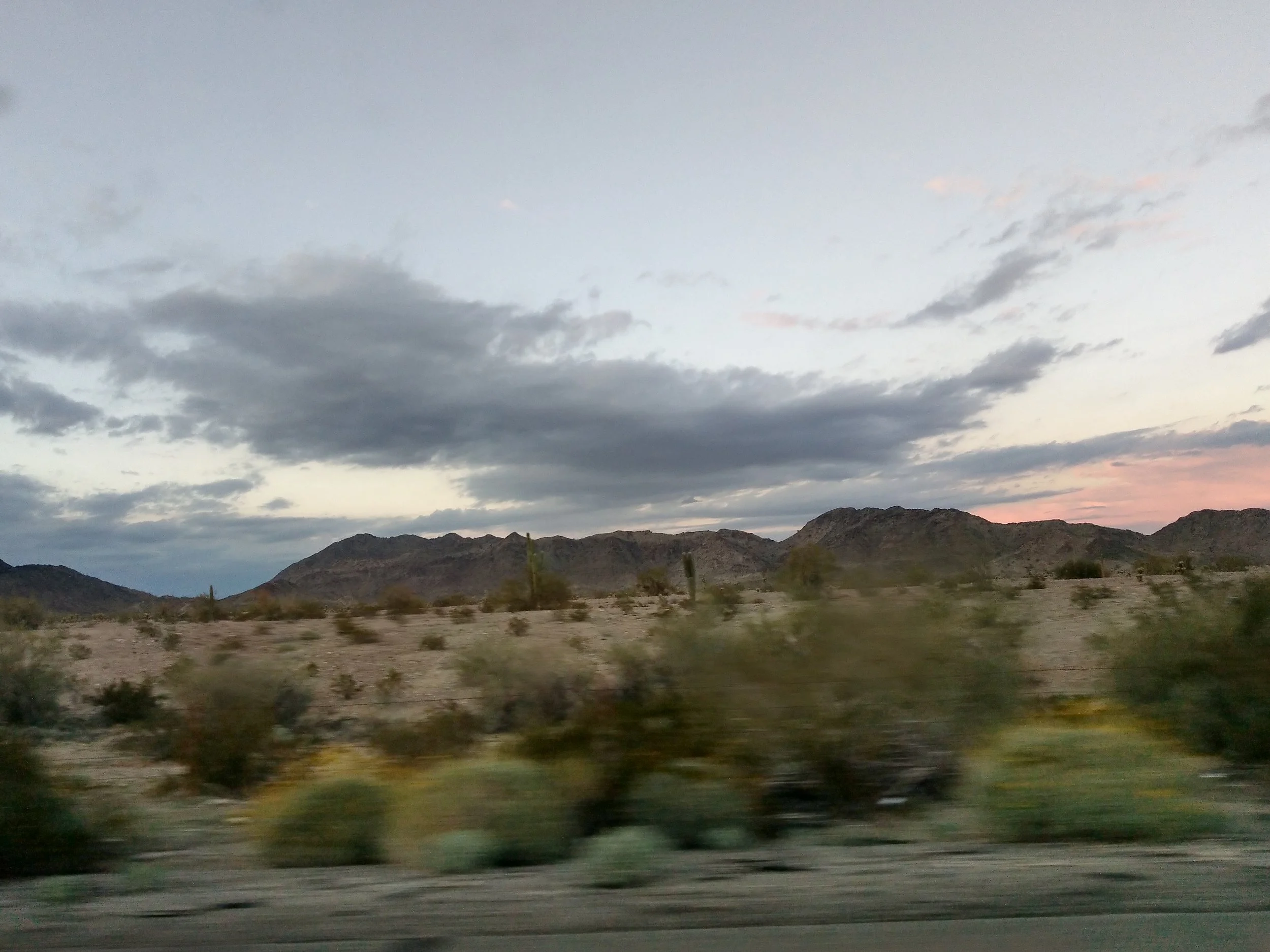 The foreground’s a blur as we were starting to drive back, but a few saguaro cacti are visible in the background.