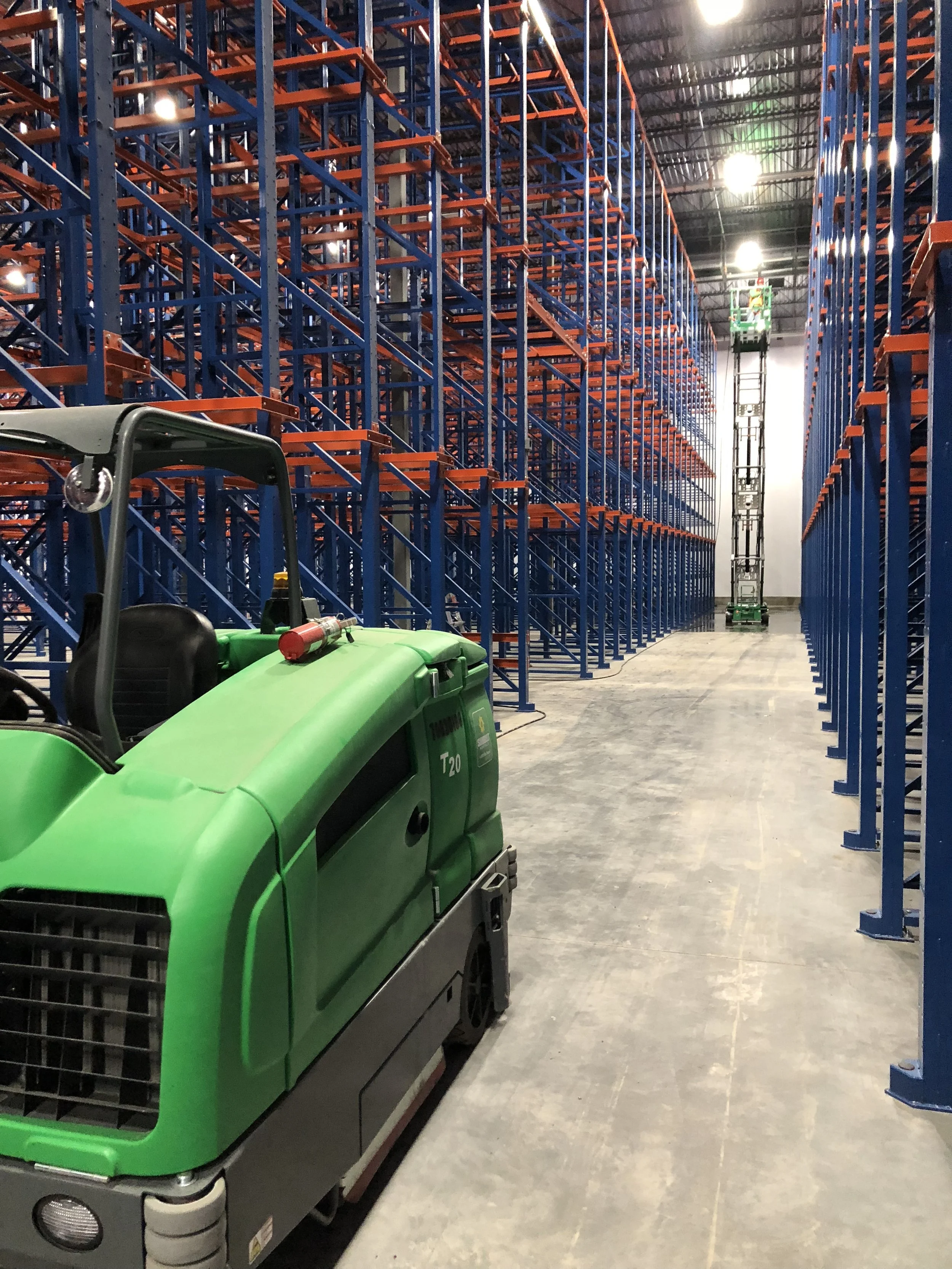 Industrial Warehouse, Washing Pallet Racking, Walls, And Concrete Floor