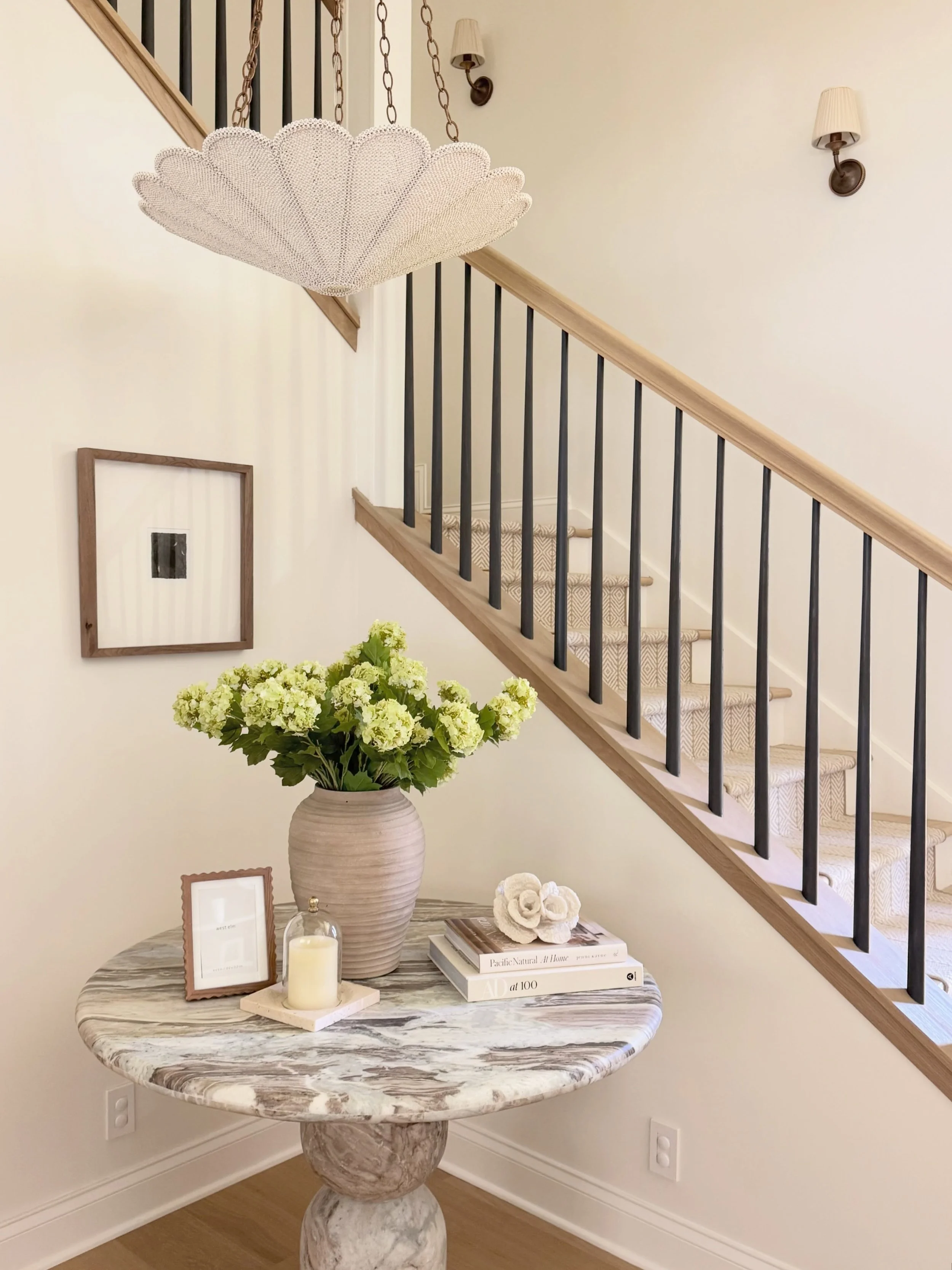 A sneak peek of the beautiful foyer from one of our projects🤎 Swipe to see our rendering and how amazing it is to see it come together✨