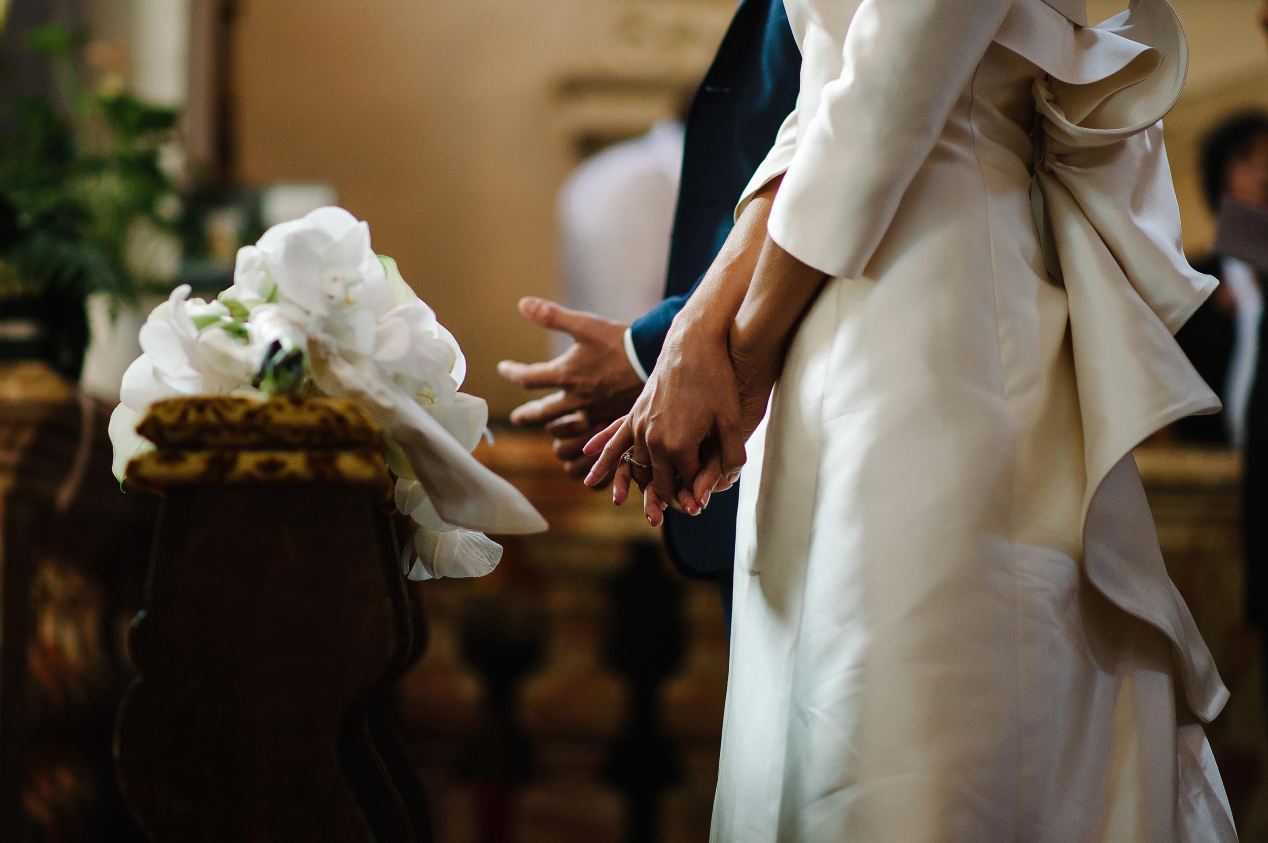 bride-and-groom-hands-touching-their-rings-after-rings-exchange-lugano-switzerlang.jpg