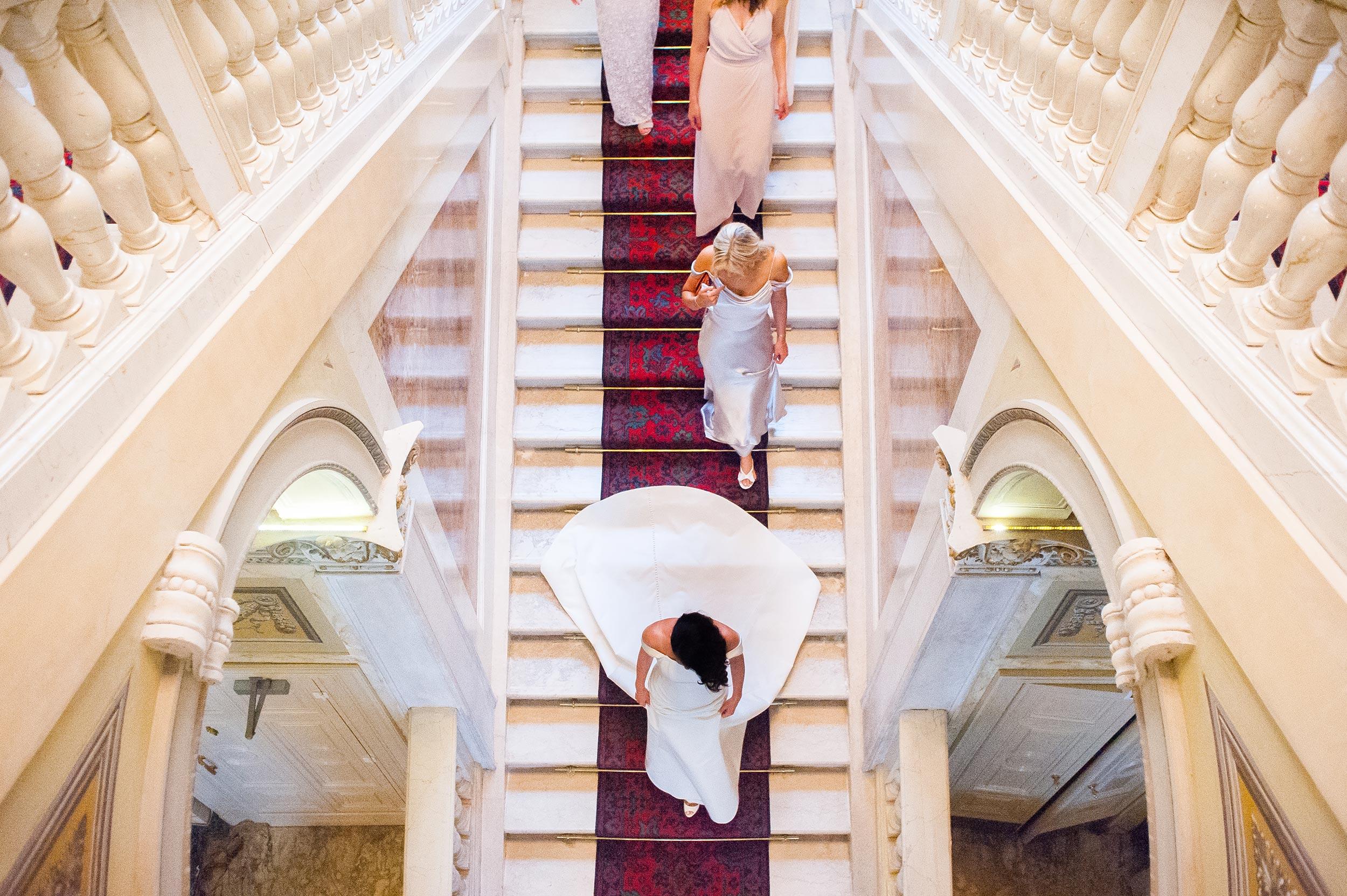 wedding-in-lake-como-bride-and-bridal-party-coming-down-the-steps-symmetry-wes-anderson.jpg