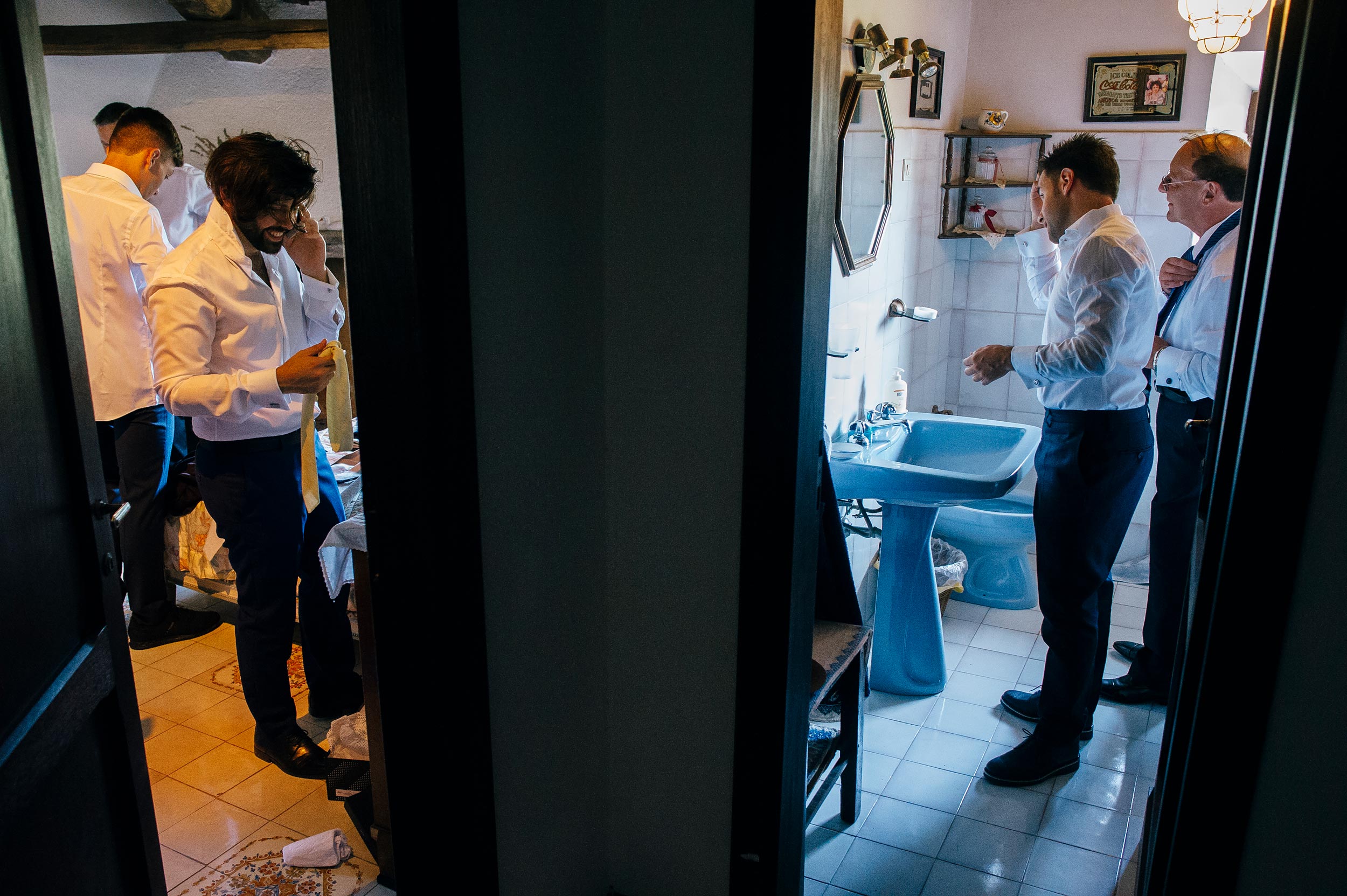 groom-his-dad-and-other-men-getting-ready-before-wedding-in-italy.jpg