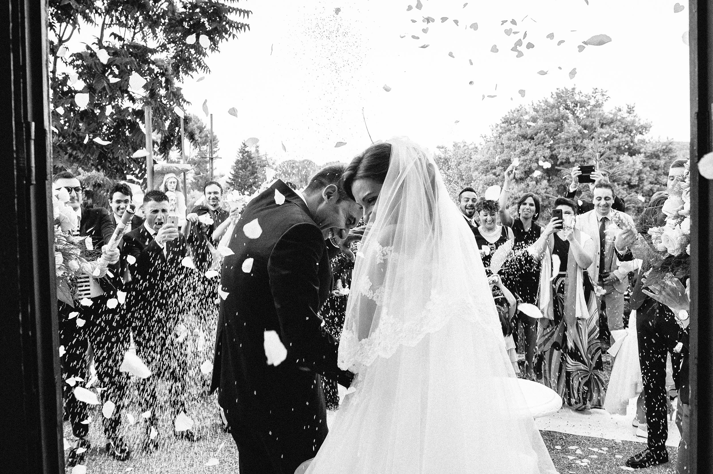 wedding-in-southern-italy-confetti-rice-outside-the-church-black-and-white-wedding-photography.jpg