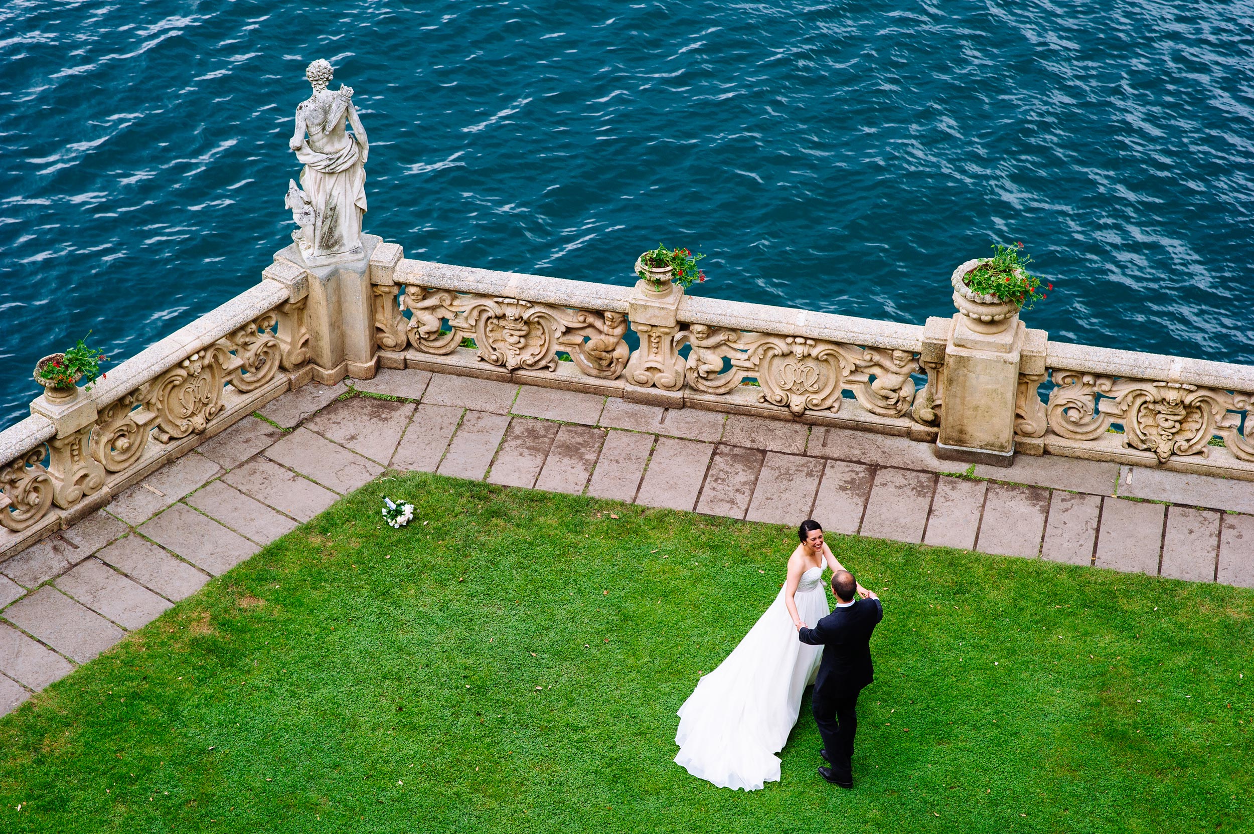 bride-and-groom-dancing-balcony-Villa-Del-Balbianello-Bellagio-Lake-Como-Wedding-Photographer-Italy-Alessandro-Avenali.jpg