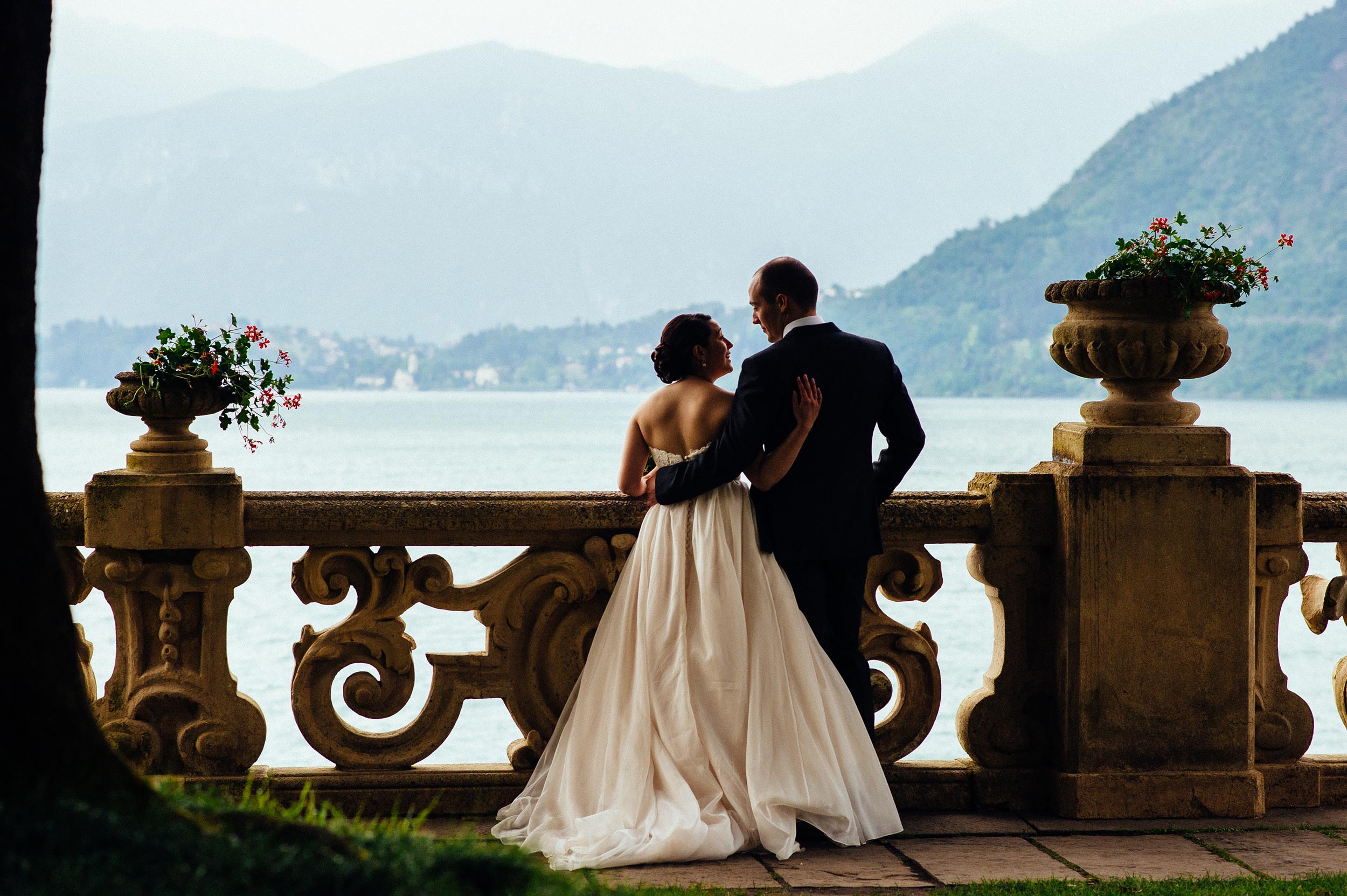 bride-and-groom-looking-balcony-Villa-Del-Balbianello-Bellagio-Lake-Como-Wedding-Photographer-Italy-Alessandro-Avenali.jpg