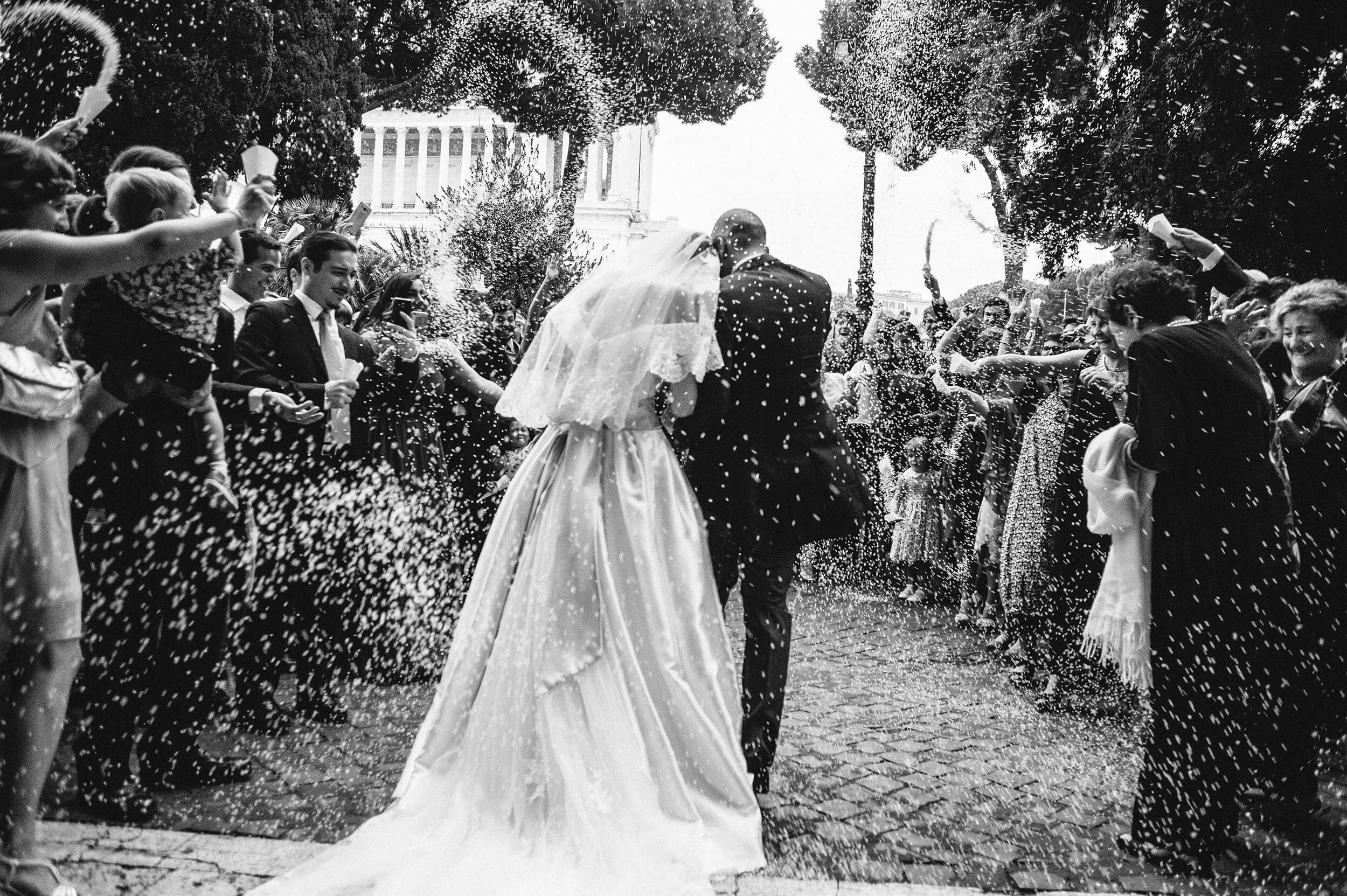 confetti-rice-outside-the-church-rome-san-marco-black-and-white-wedding-photography.jpg